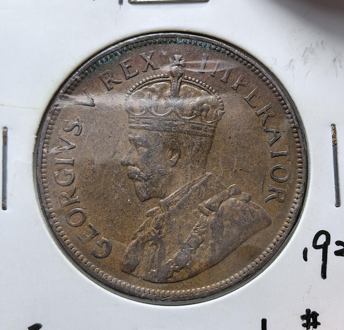 外国优质老铜币银币苏联纪念章，每周六晚九点倒数截拍，满百包邮可寄存，持续收拍 英属南非联邦1929年便士，正面为英王乔治五世头像，背面是荷兰东印度公司 “单峰驼号” 帆船，标注英 / 阿双语国名与面值，见证南非作为英国自治领的殖民货币体系。