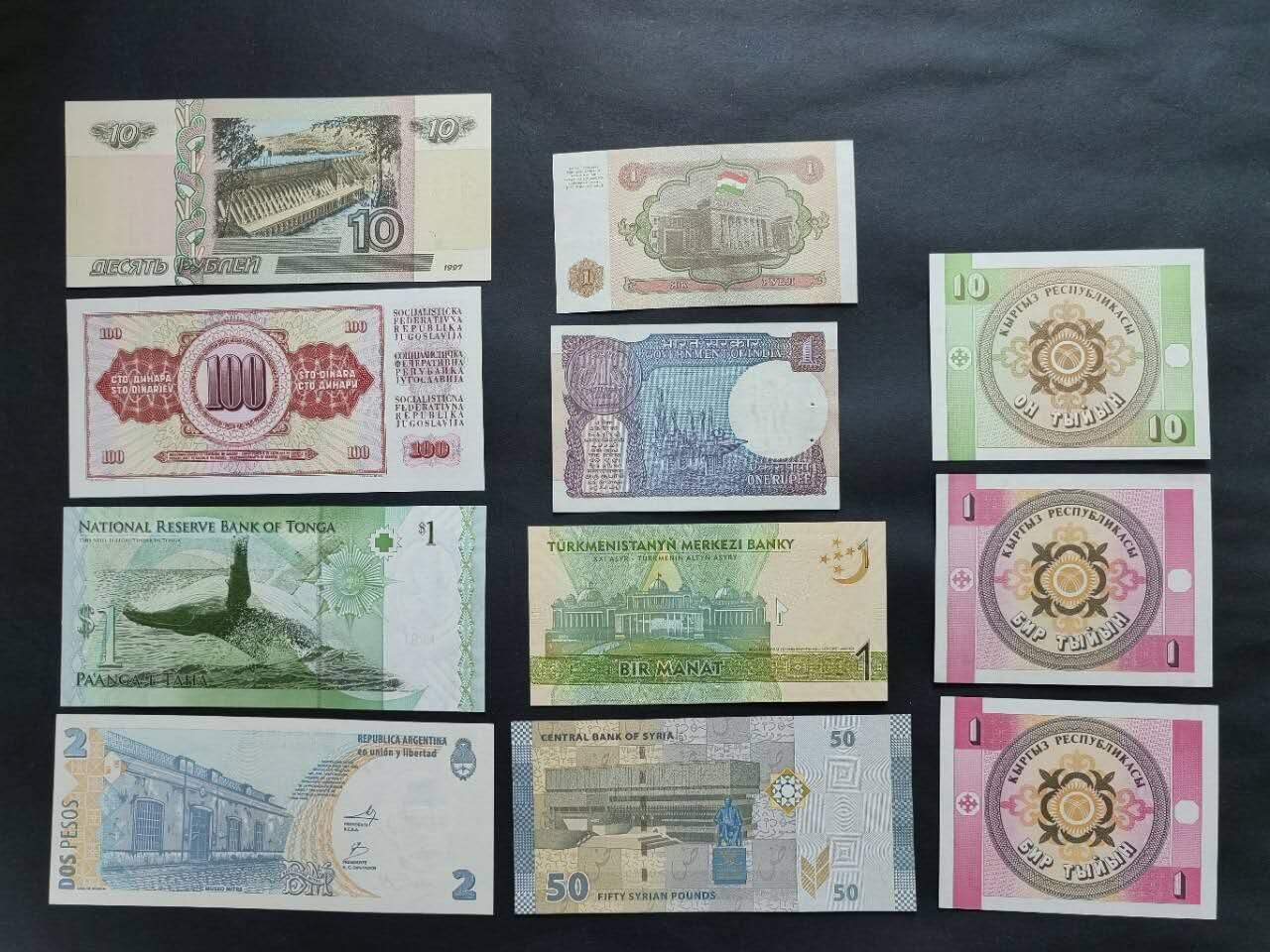 外国纸币专场260307场 不同国家11张，全新品相UNC。