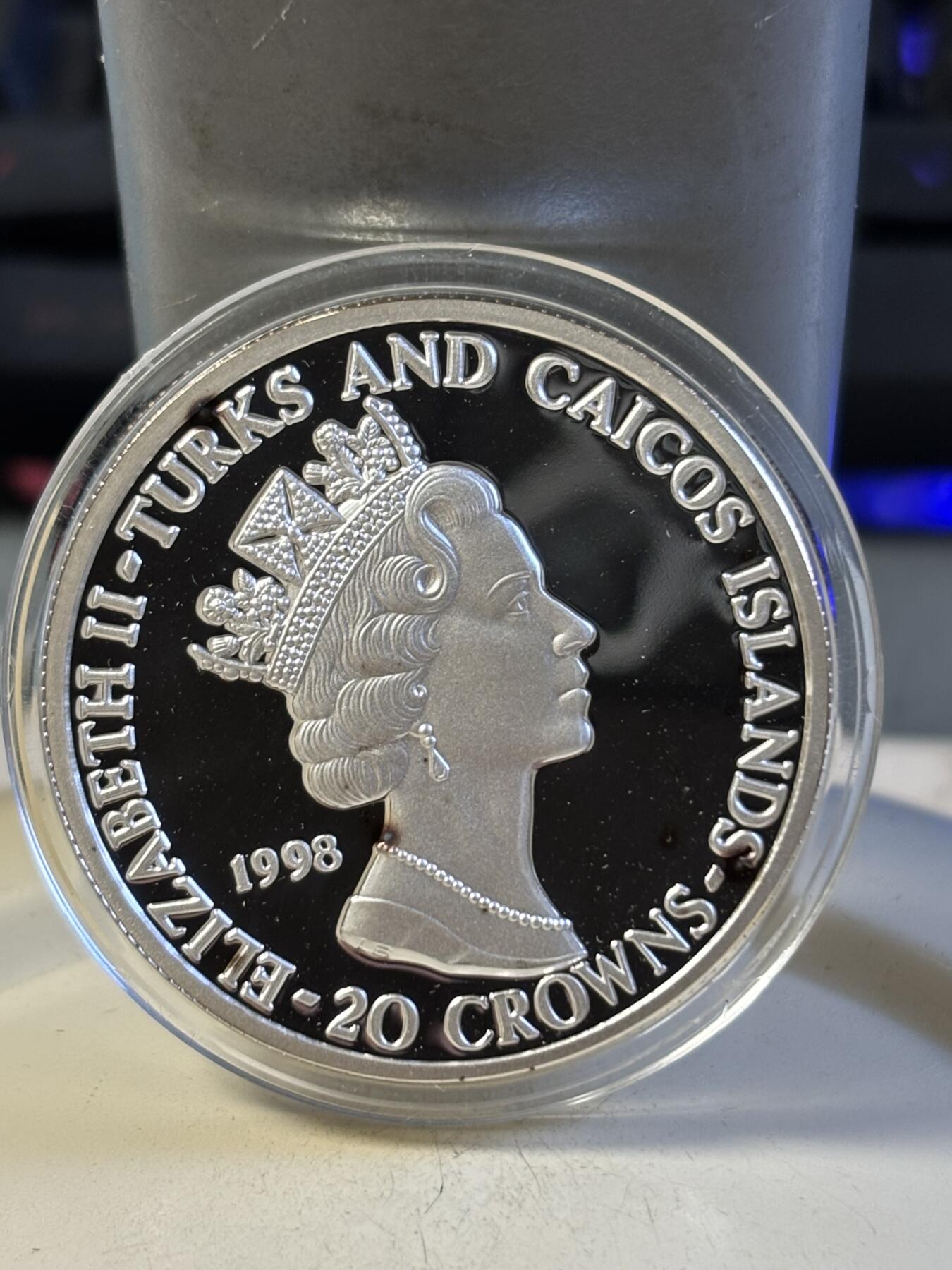 第193期拍卖 特克斯和凯科斯1998年皇家空军之战斗机28.28克纪念银币1，999银，有黑点