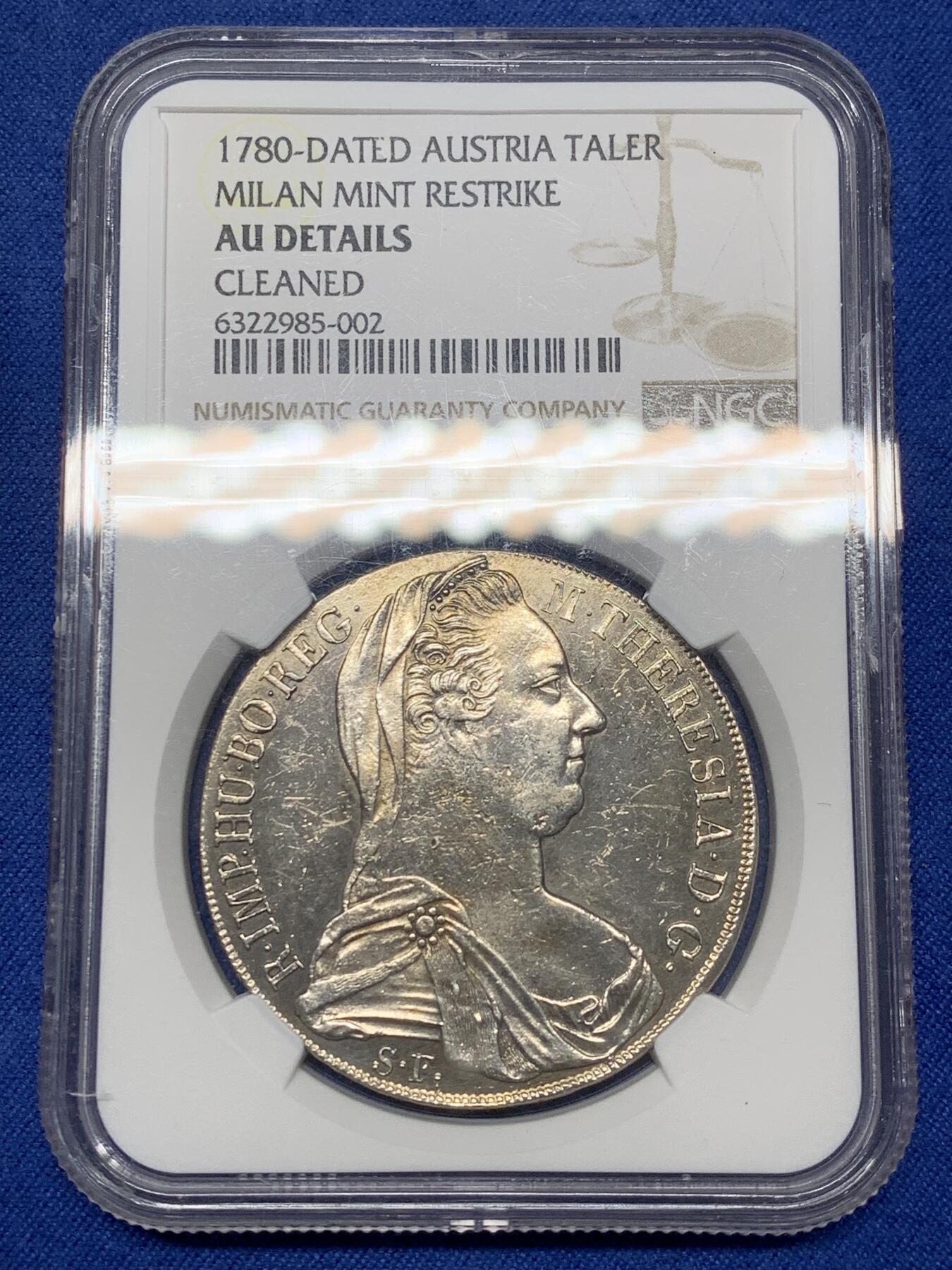 《竞宝斋》第468场 周日，周一 2场连拍 （全场包邮）欢迎送拍 NGC AU 少见1815至1828年米兰版玛丽亚特蕾莎贸易银币经典“中心正圆九珍珠”披风针，目录编号：哈夫纳36a。该版本为女皇逝世后，为了迎合近中东贸易货币使用习惯，由奥属意大利米兰造币厂铸造的版本，主要流通于北非、中东地区，是历史上真正参与流通的行用币！背面为减重痕。