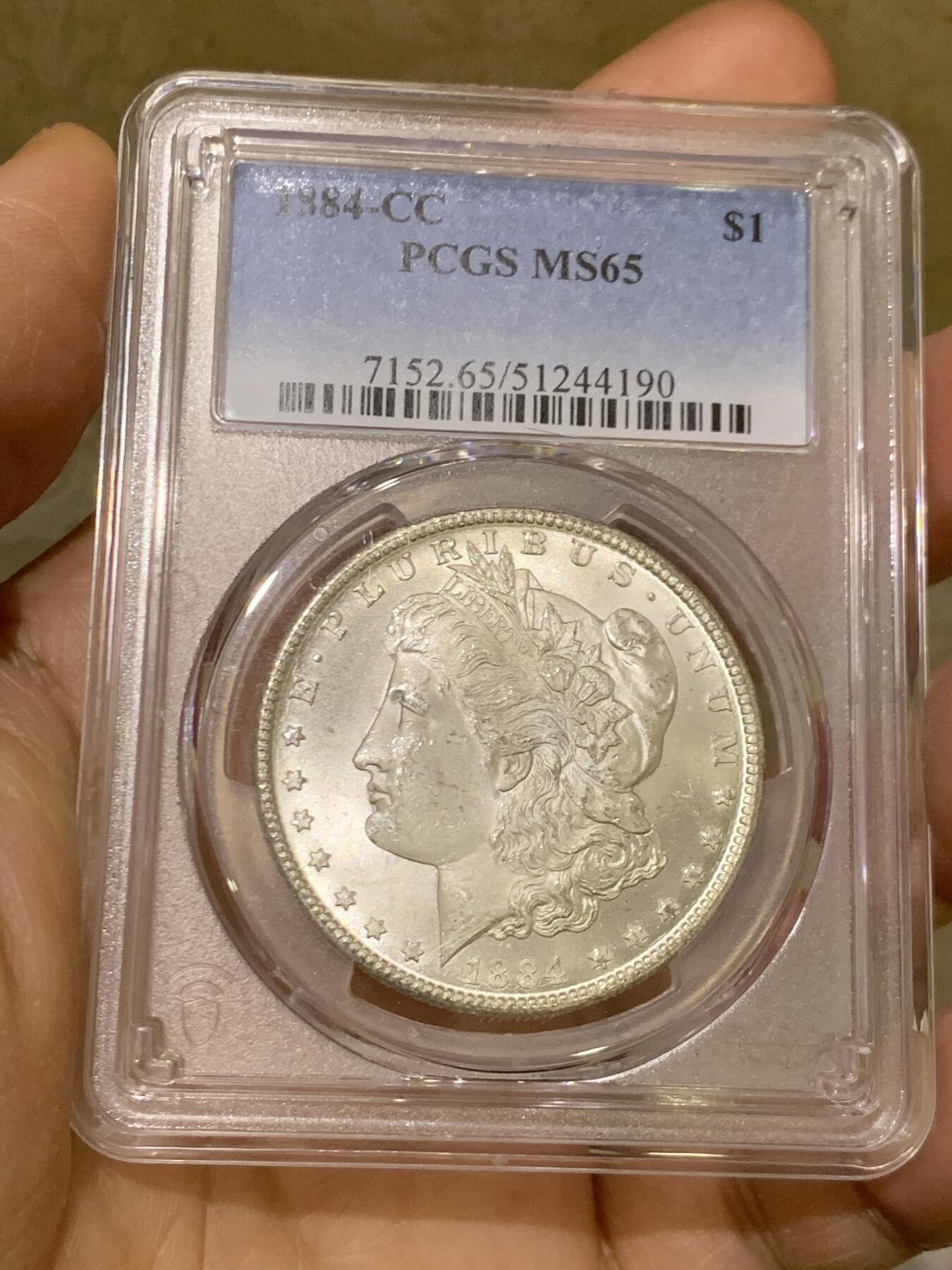 《竞宝斋》第468场 周日，周一 2场连拍 （全场包邮）欢迎送拍 PCGS MS65 美国 1884 CC 摩根 稀有卡森厂 高分难得 车轮转光