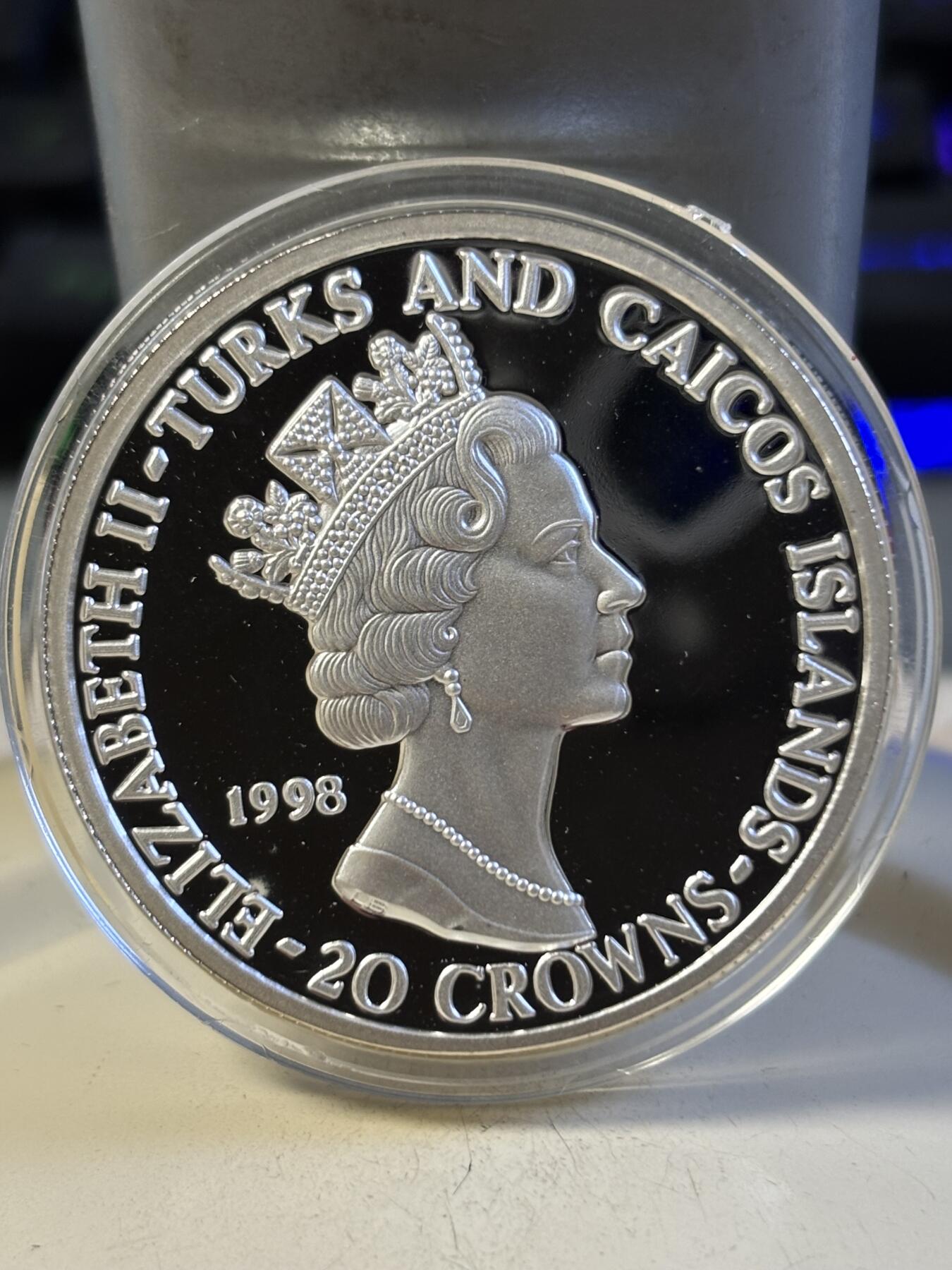 第193期拍卖 特克斯和凯科斯1998年皇家空军之战斗机28.28克纪念银币2，999银，38.61毫米