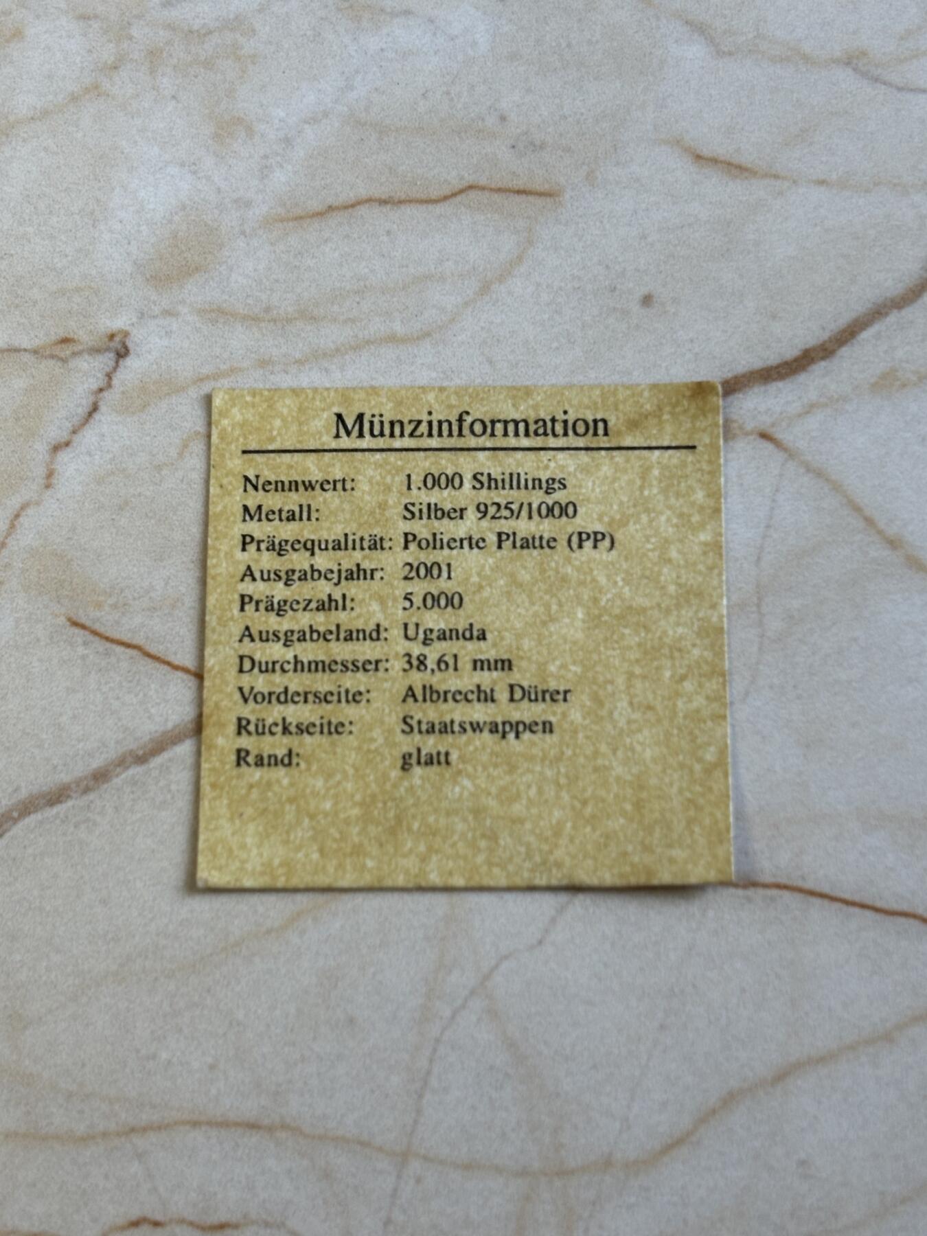 第193期拍卖 乌干达2001年人物丢勒精制纪念银币带证书，925银，20克，发行5000枚，塑料盒有裂痕