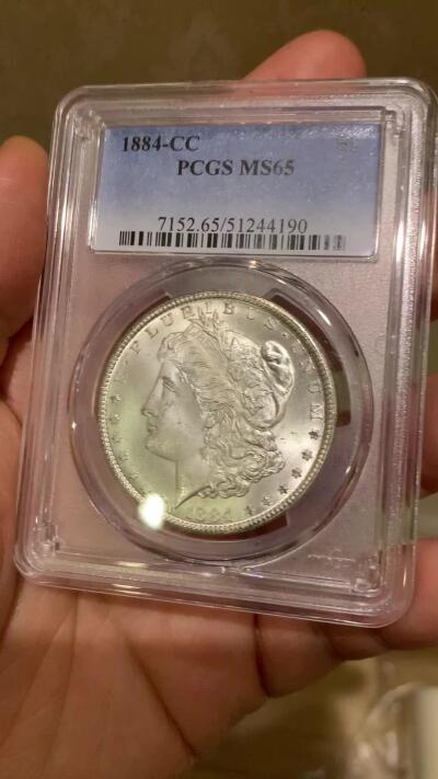 《竞宝斋》第468场 周日，周一 2场连拍 （全场包邮）欢迎送拍 PCGS MS65 美国 1884 CC 摩根 稀有卡森厂 高分难得 车轮转光