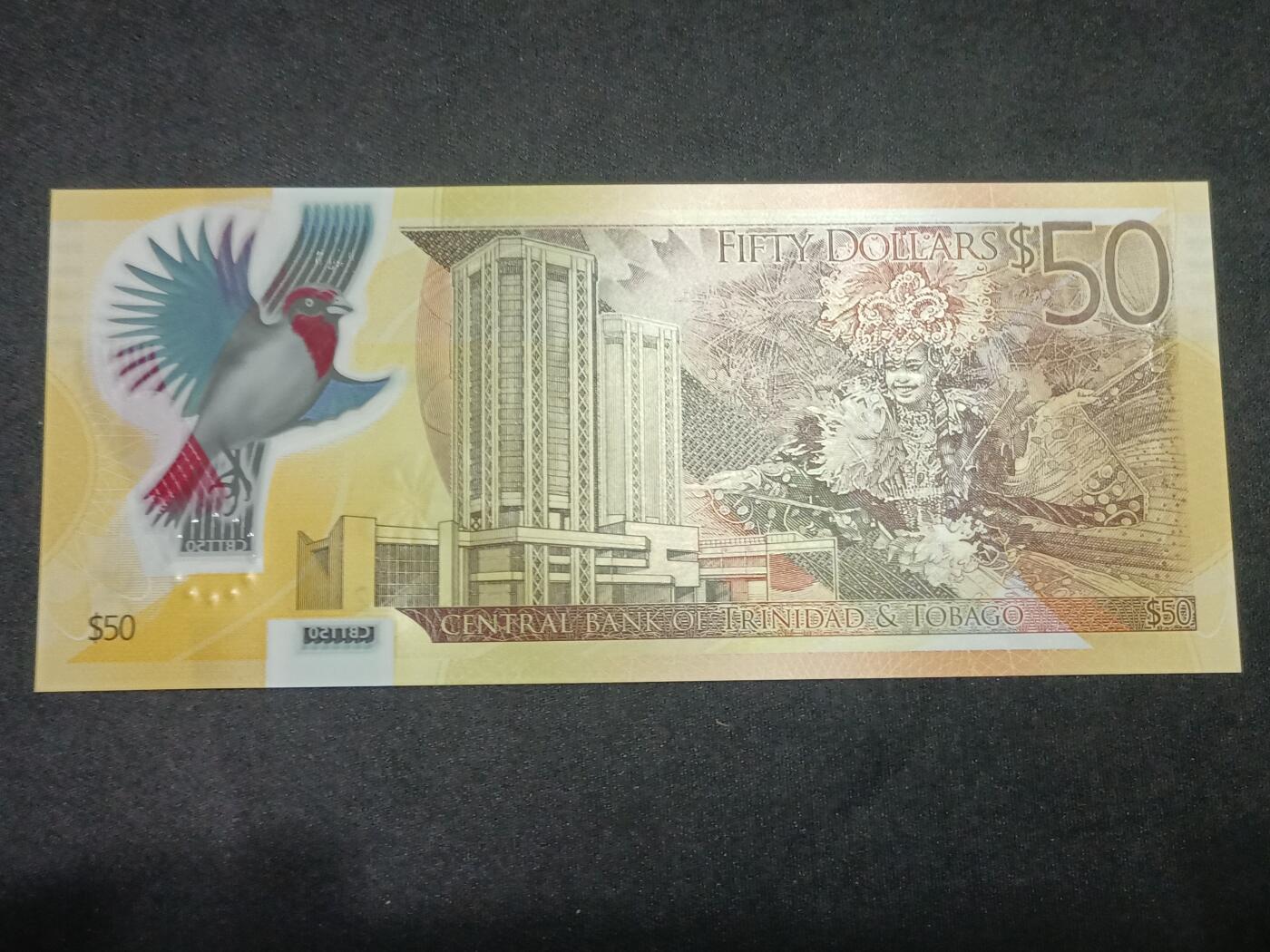 【游宝拍卖】丙午马年第10期 特立尼达和多巴哥-50元【2015年 IBNS获奖钞 CH552562 全新UNC】