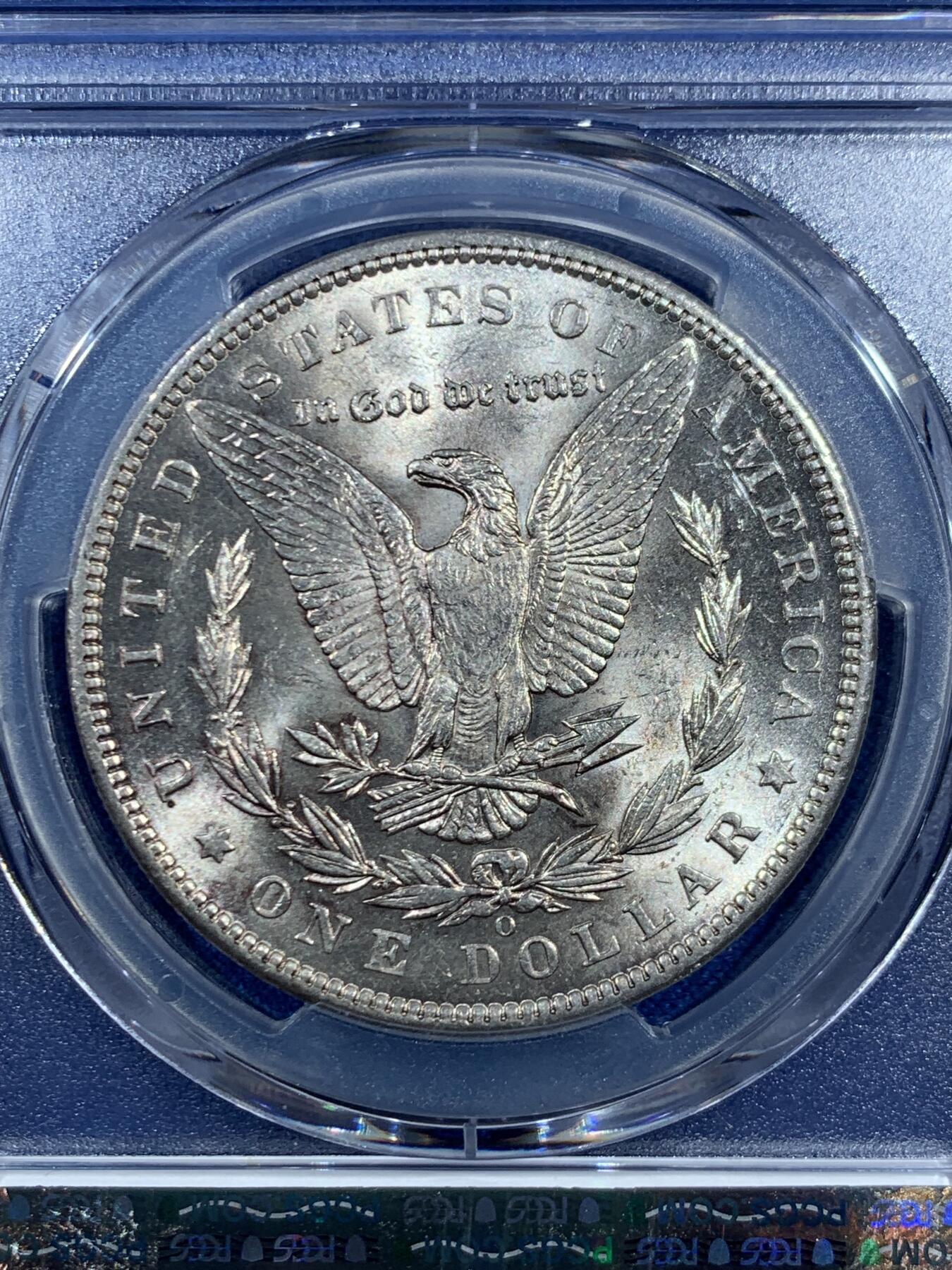 《竞宝斋》第469场 周日，周一 2场连拍 （全场包邮）欢迎送拍 PCGS AU58 美国 1897 O 摩根银币 此年份摩根大量钱币於法案中被融毁 因此好品难寻 麦稀奇首见如此高分稀有钱币 此币乃收藏中必不可少的一环 转光犀利 PCGS指导价3991