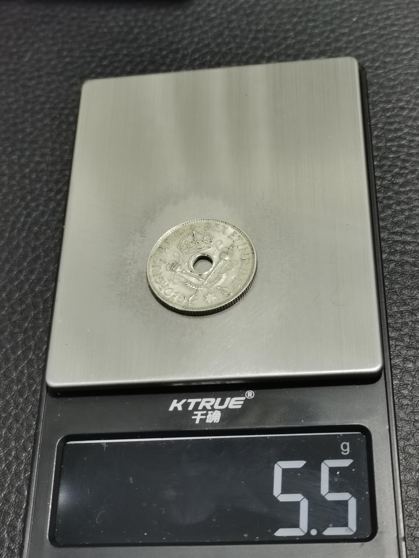 天下钱庄专场欢迎参拍 新几内亚中孔银币