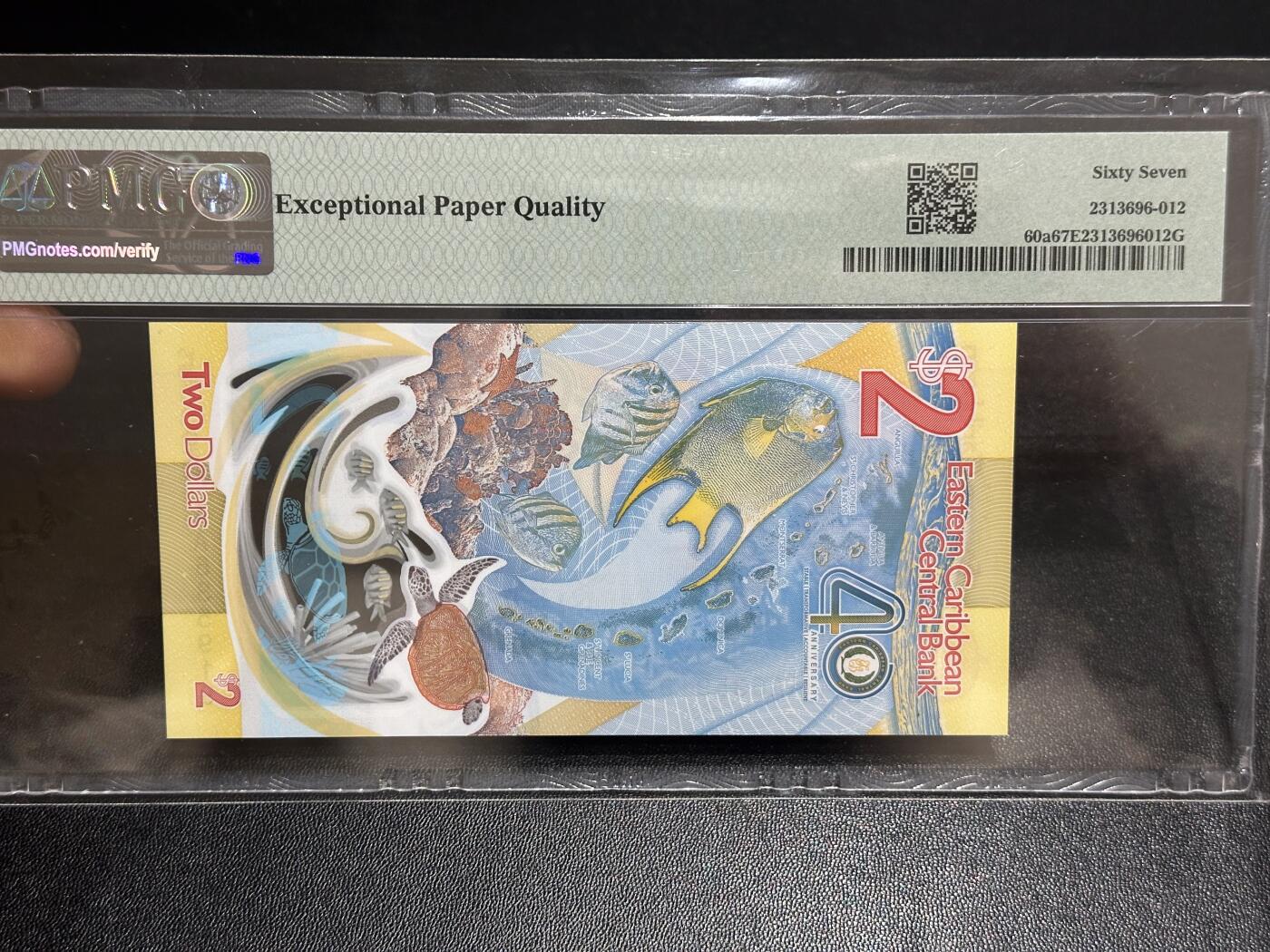 《外钞收藏家》第六百一十六期（精品场）（长期征集拍品、欢迎藏友们联系合作） 2023年东加勒比40 纪念钞 PMG67 AA冠 无47靓号 获奖钞