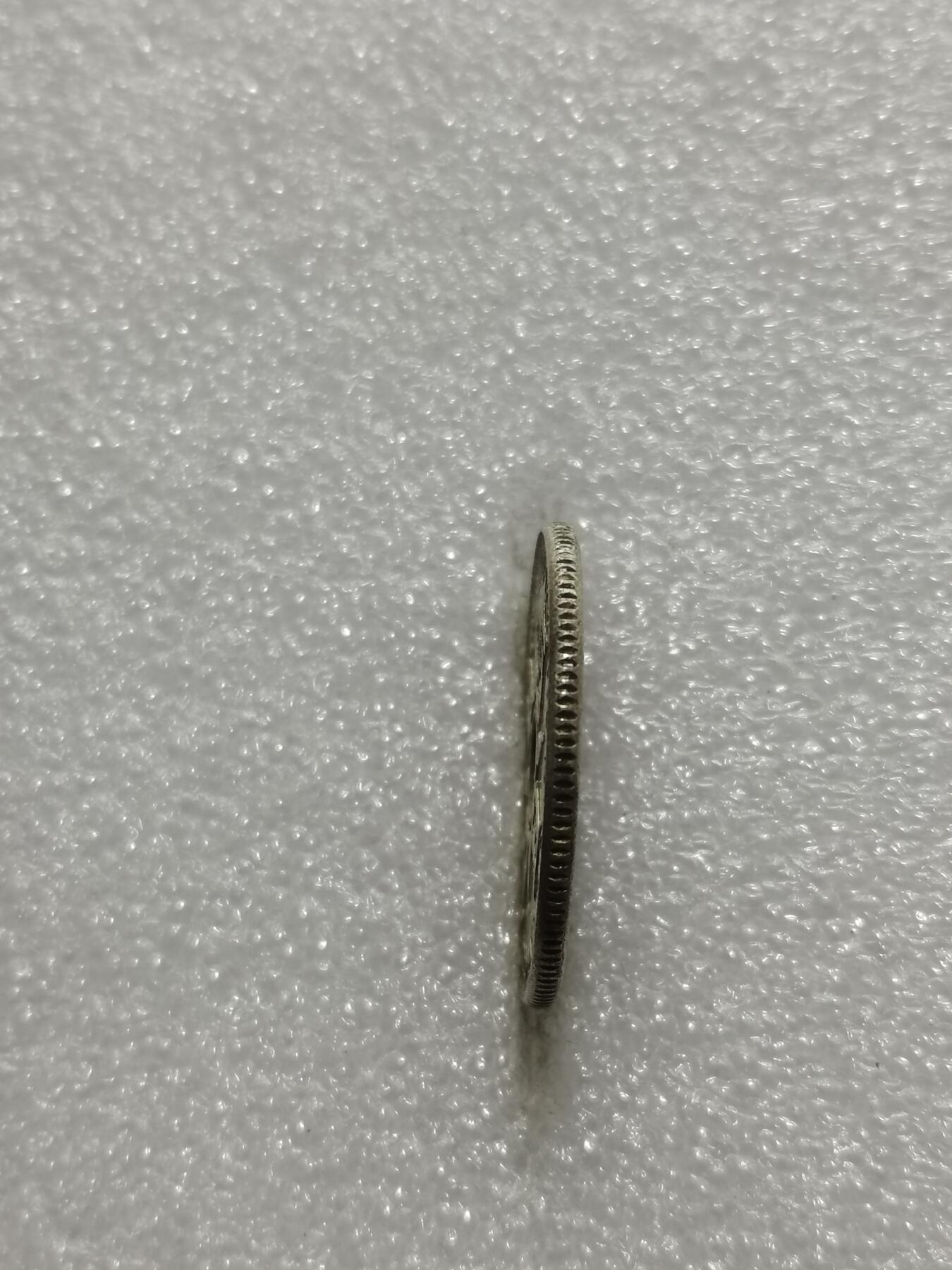 天下钱庄专场欢迎参拍 新几内亚中孔银币