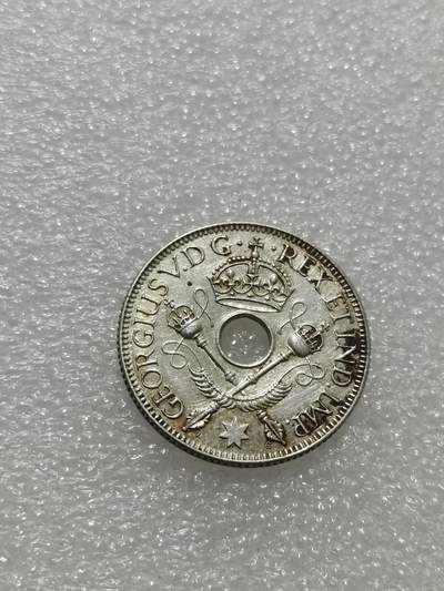 天下钱庄专场欢迎参拍 - 新几内亚中孔银币