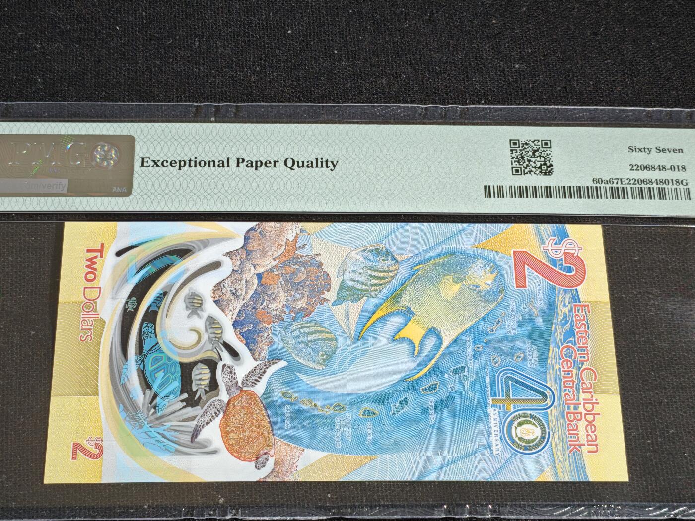 刘世昌艺术品销售中心～虎踞龙蟠*金杨在线联拍群第519期 东加勒比2023年“央行成立40周年”2元纪念钞（PMG   67E   号码：AB205902）1枚。此币荣获当年IBNS“世界最佳纸币”大奖。