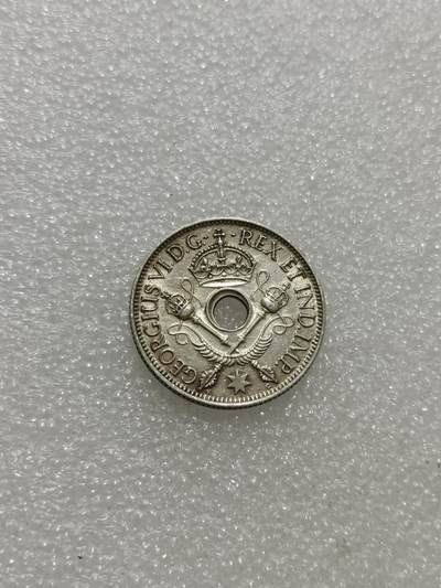 天下钱庄专场欢迎参拍 - 新几内亚中孔银币