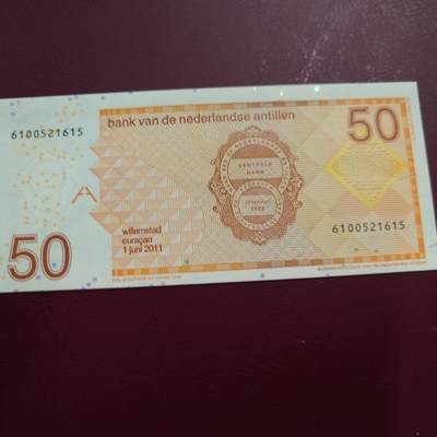 世界钱币～微拍第239期暨2026年第20期  部分尾货整理陆续低价起拍清仓 - 2011年荷属安地列斯群岛50元 全新无47 如图全息膜处有瑕疵 尾号615