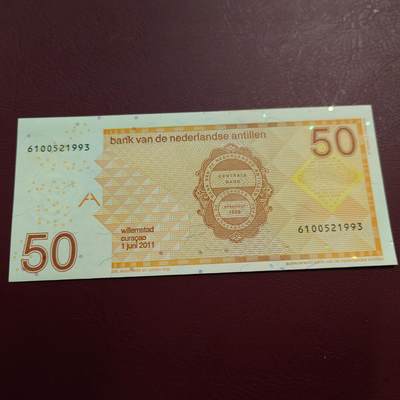 世界钱币～微拍第239期暨2026年第20期  部分尾货整理陆续低价起拍清仓 - 2011年荷属安地列斯群岛50元 全新无47 如图全息膜处有瑕疵 尾号993