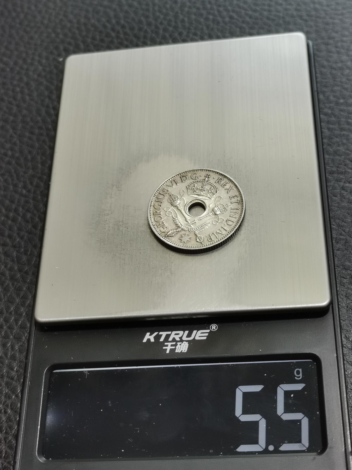 天下钱庄专场欢迎参拍 新几内亚中孔银币