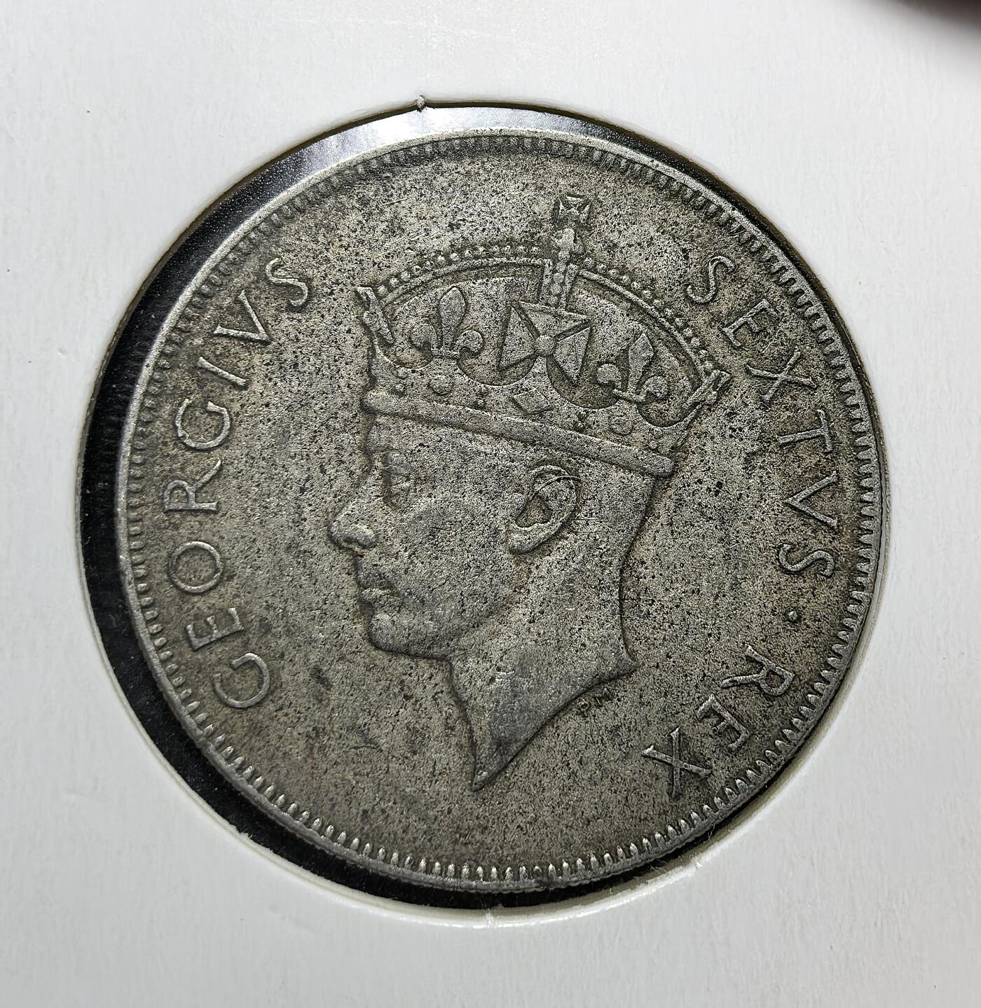 外国优质老铜币银币苏联纪念章，每周六晚九点倒数截拍，满百包邮可寄存，持续收拍 英属东非1952年1先令，正面为乔治六世头像，背面是象征非洲的狮子图案，见证英国殖民统治下东非的统一货币体系与殖民经济背景。