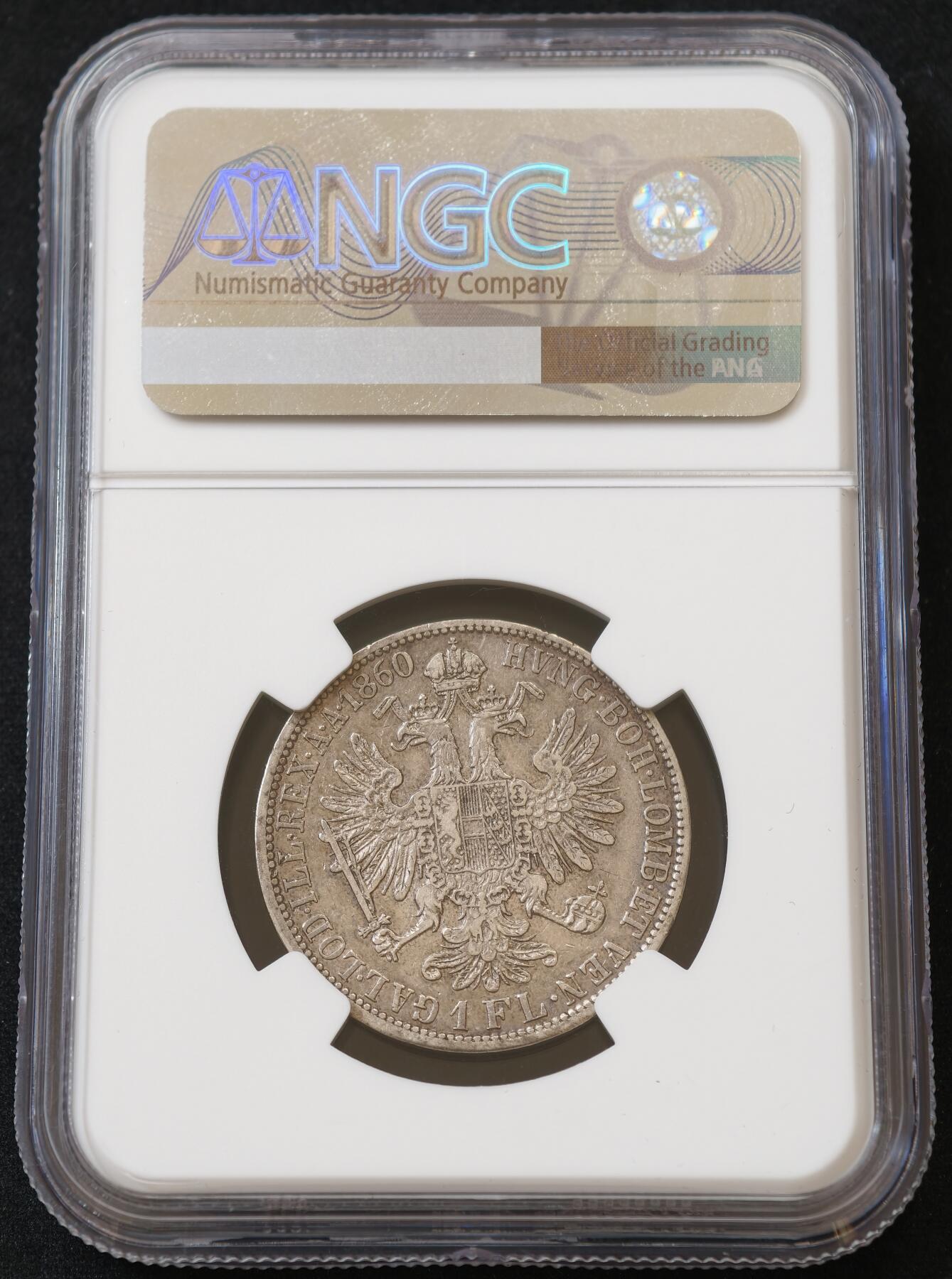甄臻铺-世界币章拍卖（第54期），3月28日甄品场拍品征集中，送拍享返佣金等优惠多多 NGC-XF 1860年A版青年约瑟夫1福林银币 弗朗茨约瑟夫 一弗洛林 弗朗茨1福林 成色不错 转光明显 细节完好 900银 克重12.3g 相较老年版造量和存世量都少很多