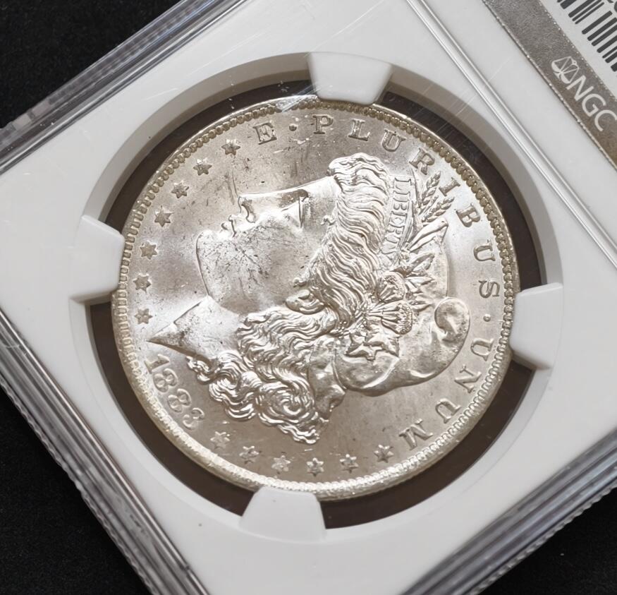 甄臻铺-世界币章拍卖（第54期），3月28日甄品场拍品征集中，送拍享返佣金等优惠多多 NGC-MS64 1883年O版美国摩根，少见年份