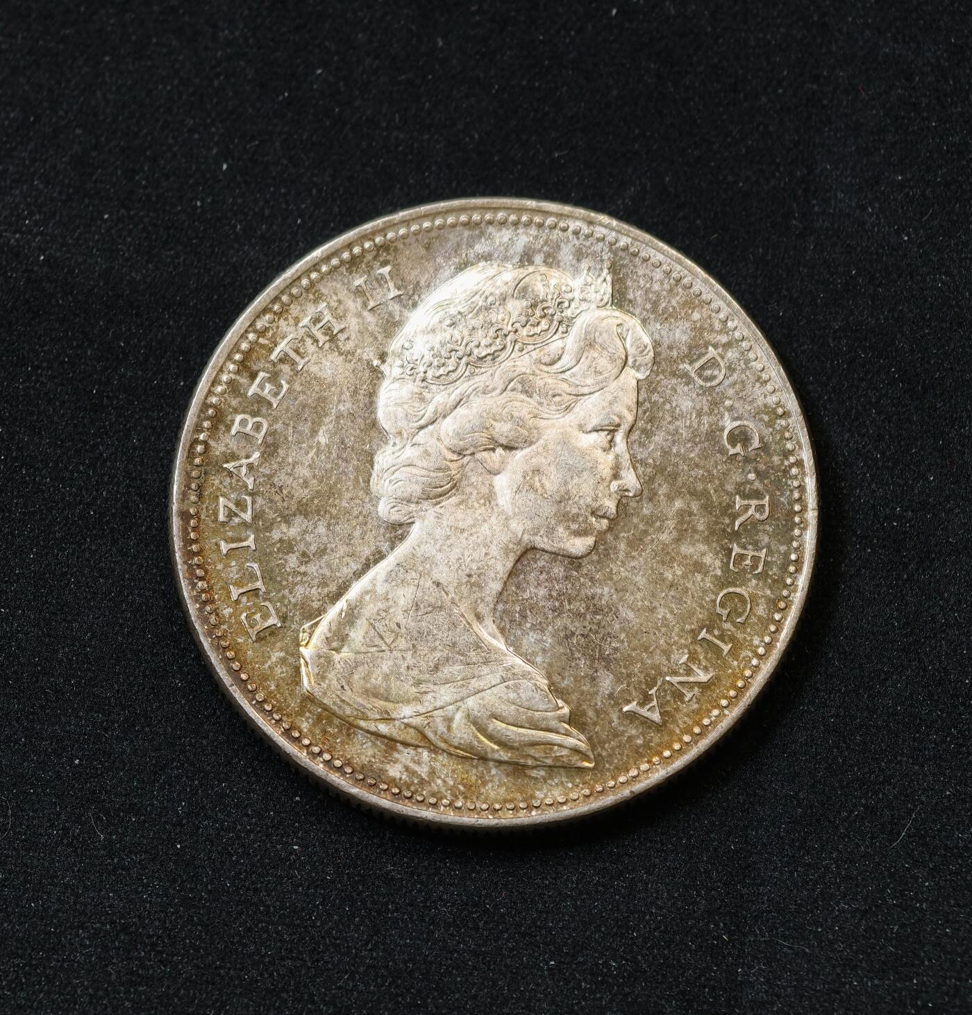 甄臻铺-世界币章拍卖（第54期），3月28日甄品场拍品征集中，送拍享返佣金等优惠多多 加拿大1966年划船一元银币 淡金包浆UNC转光 800银