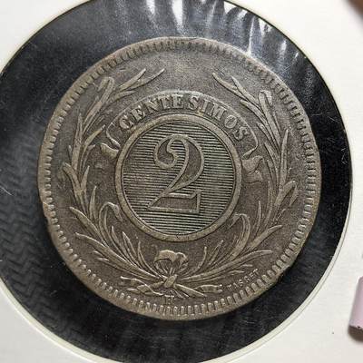 外国优质老铜币银币苏联纪念章，每周六晚九点倒数截拍，满百包邮可寄存，持续收拍 - 乌拉圭东岸共和国1869年2分铜币，正面为象征自由的五月太阳与国名，背面是面值与月桂枝环，见证乌拉圭独立后货币体系的建立与 19 世纪南美国家的经济发展。