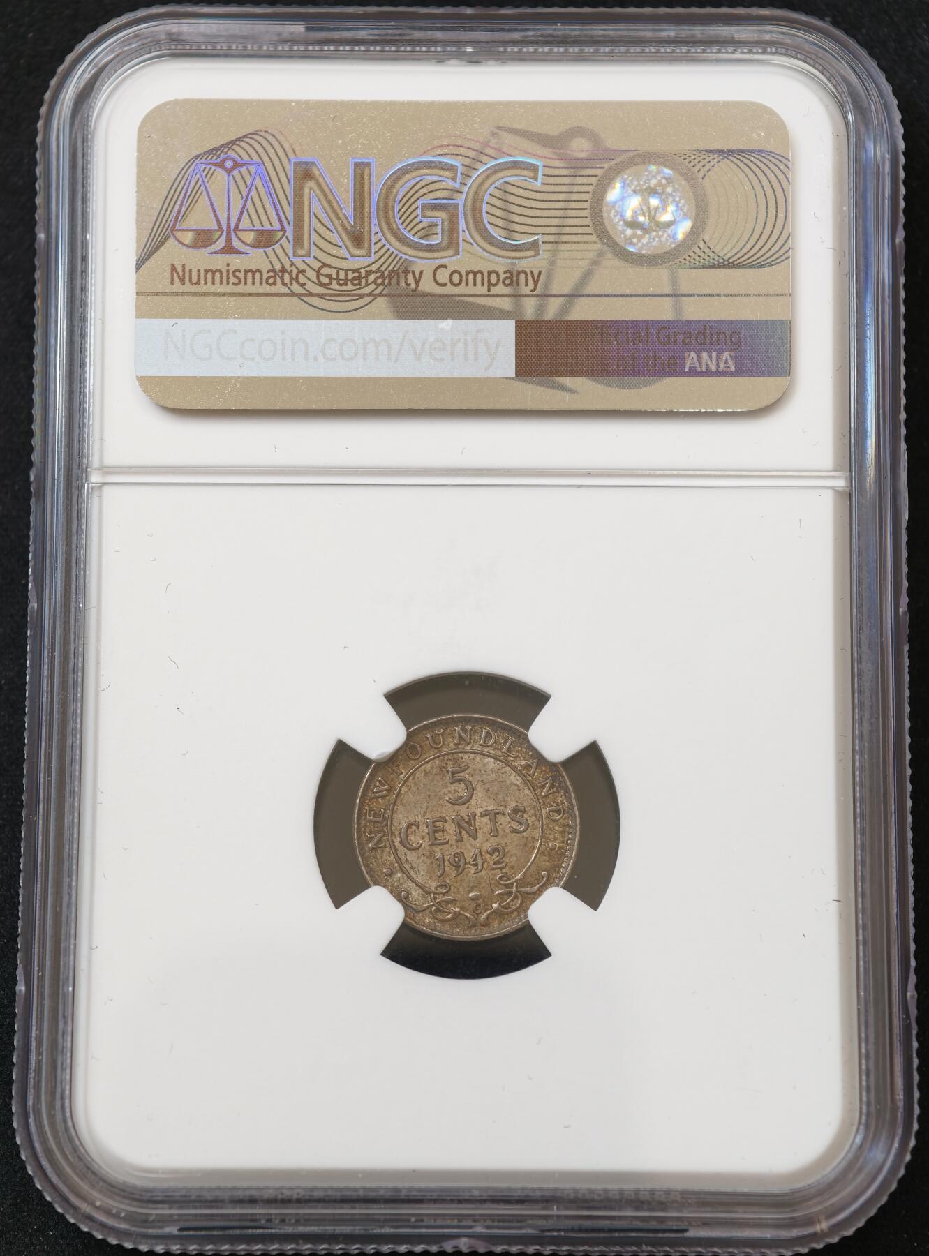 甄臻铺-世界币章拍卖（第54期），3月28日甄品场拍品征集中，送拍享返佣金等优惠多多 NGC-MS63 英属加拿大纽芬兰1942年乔治六世C版5分银币，五彩包浆，转光品相