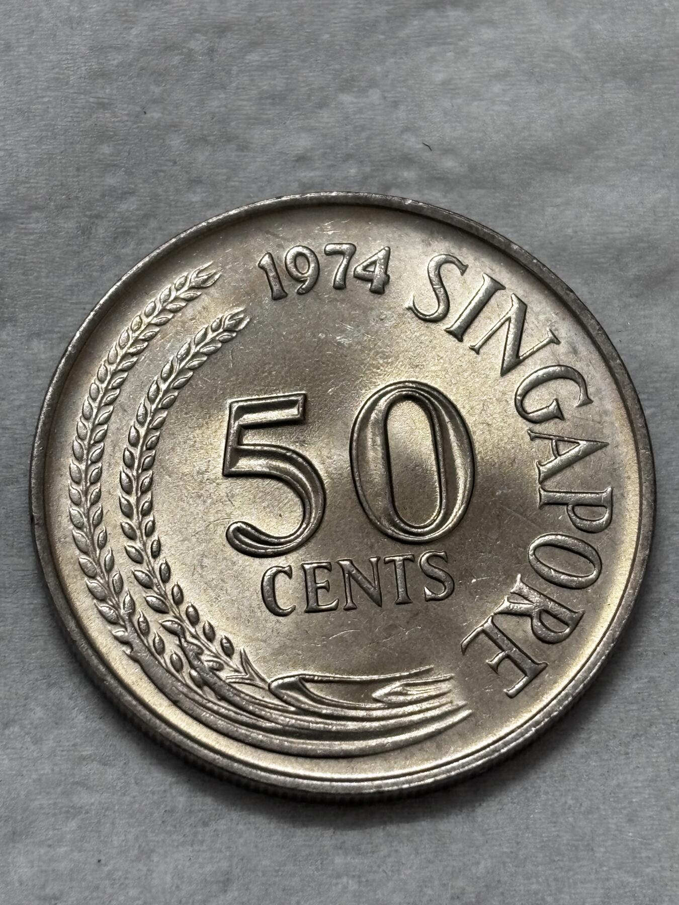 文馨钱币收藏第 296 场，长期接代拍业务 全新 1974 年新加坡老版 50 分狮子鱼