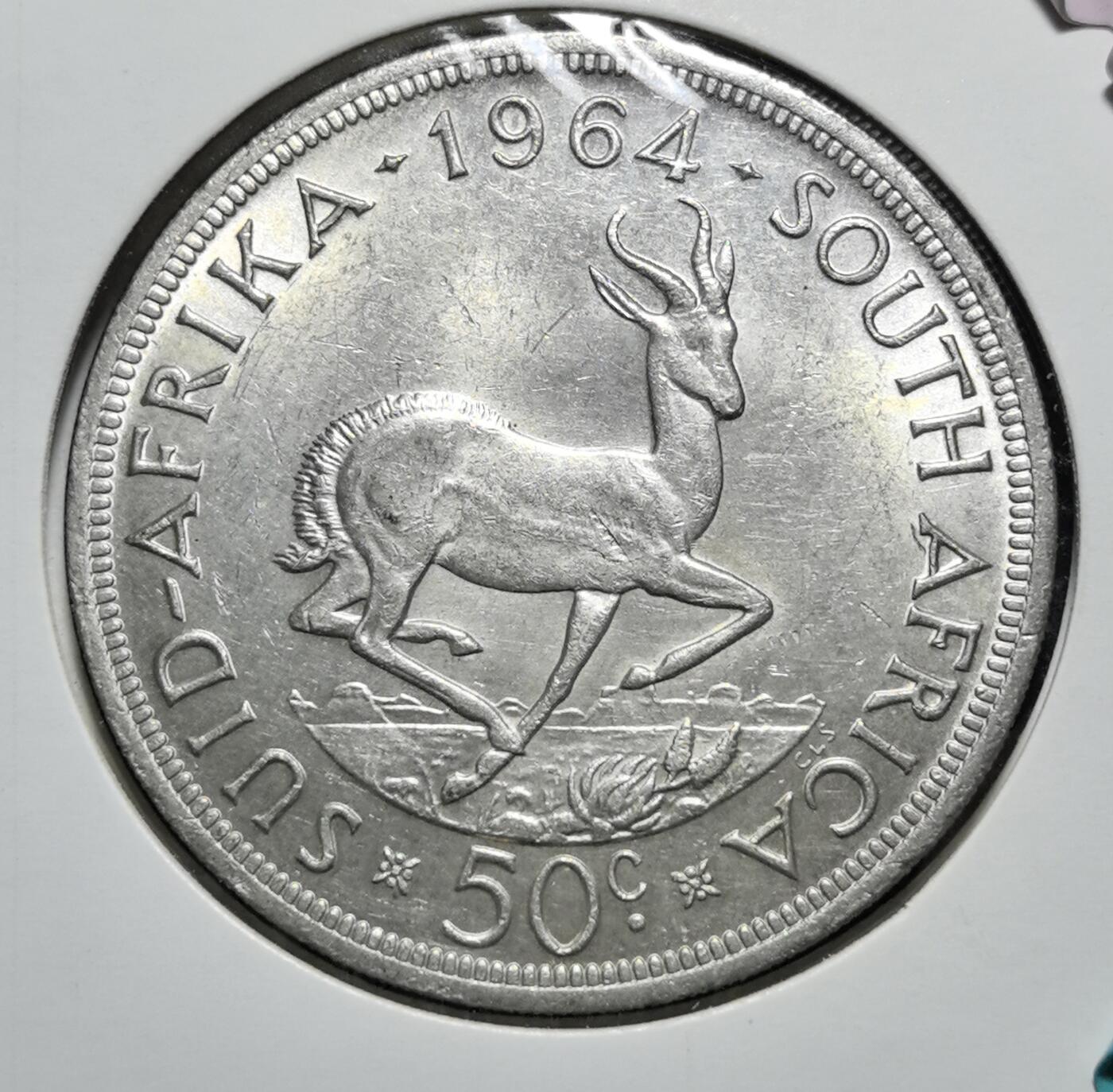 外国优质老铜币银币苏联纪念章，每周六晚九点倒数截拍，满百包邮可寄存，持续收拍 南非共和国1964年50分大银币，正面为荷兰殖民者扬・范・里贝克头像，铭文 “团结就是力量”；背面是跳羚，标注年份与面额，1965 年后改为镍币，是殖民历史与早期共和时代的见证。