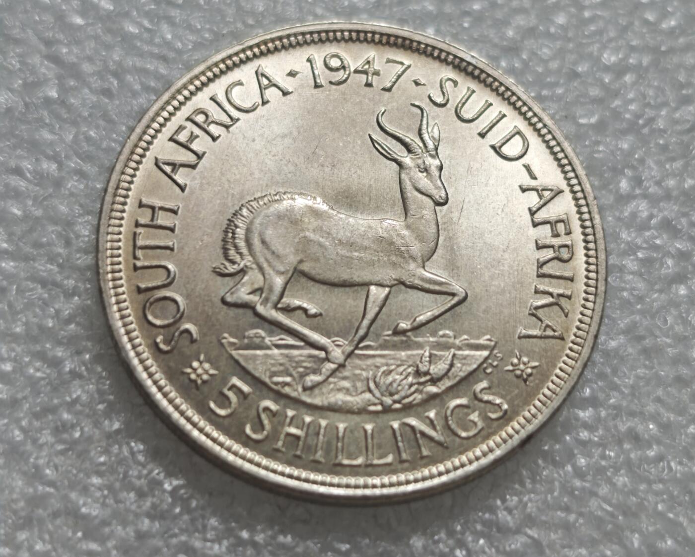 瓶子🏺第232期拍卖会  南非1947年乔治六世5先令（克朗型）银币  800纯银（含银量80%） ​直径38.6mm，重量28.28g  原光好品