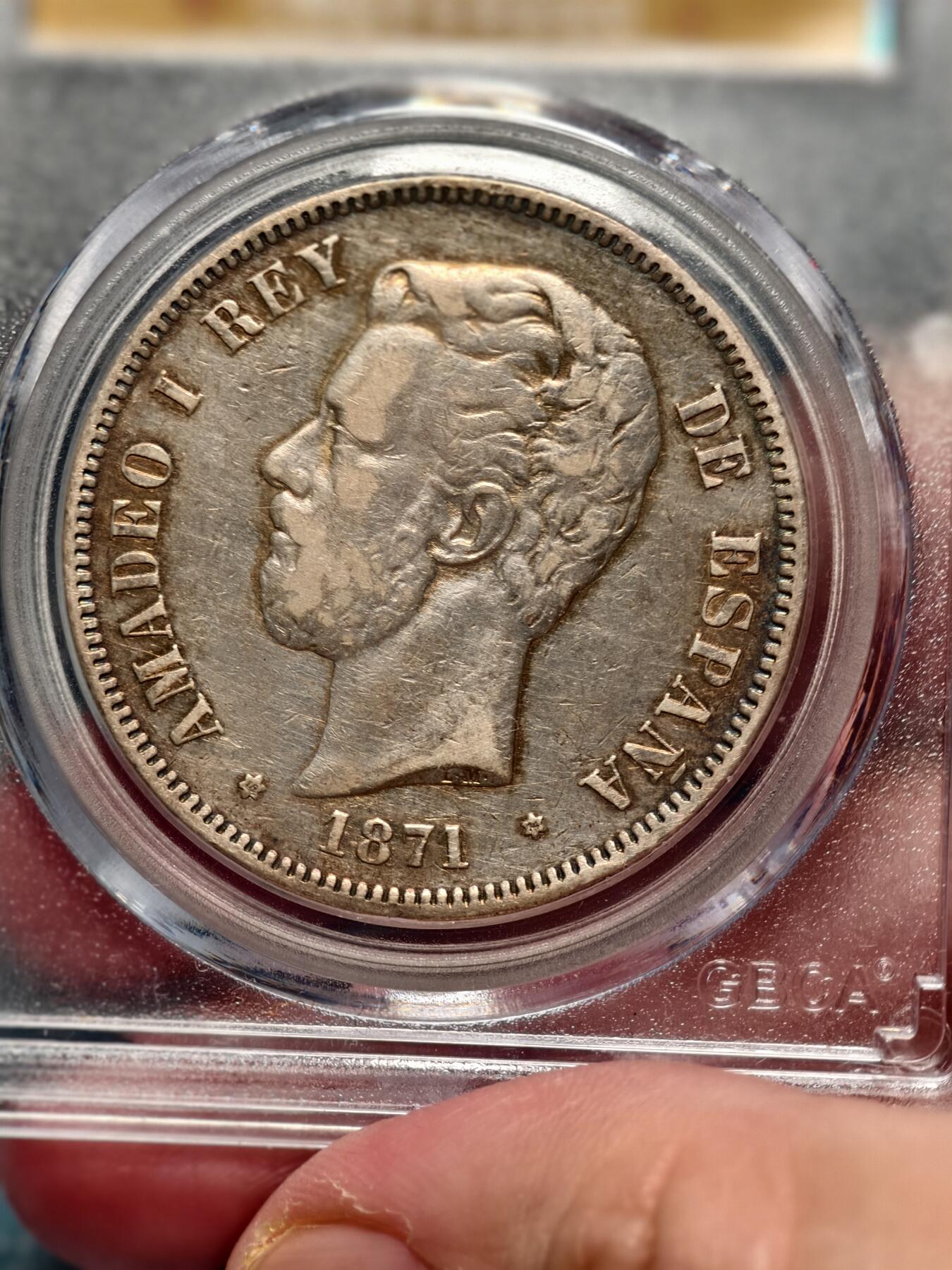 抚柳草堂-第十六期章牌钱币  奖章勋章限时免佣 满百包邮 放漏专场 1871西班牙5比塞塔双柱大银币 北京公博xf45重量标错应为24.9g  阿玛迪奥一世是意大利萨伏伊王朝的人在位仅两年多后背国徽中间是十字有别于波旁王朝的鸢尾花