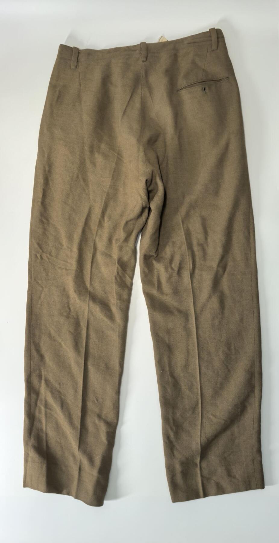 小驴勋章奖章收藏3月14日周六晚六点拍卖（珍爱和平，收藏战争，铭记历史，勿忘国耻，忠党爱国。有偿代拍，送拍规则在简介最后，参拍须阅读规则后再参拍，关系到运费包装发货时效真假辨别等关键信息，拍卖时不再发原图，看大图店主微信码在拍卖店铺介绍里） 西班牙m1943条例少尉军装一套，左胸俩奖章为复刻，右胸徽章和臂章为战后