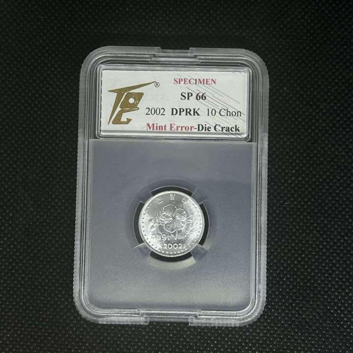 2009年（2002年版）朝鲜-第三套流通硬币10钱错版样币-模具破裂TQG评级66