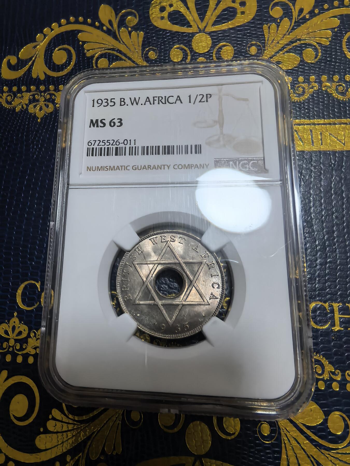 长老汇马年精选第九场拍卖 1935 英属西非乔治五世1/2便士中孔铜镍币，NGC MS63，更高5枚