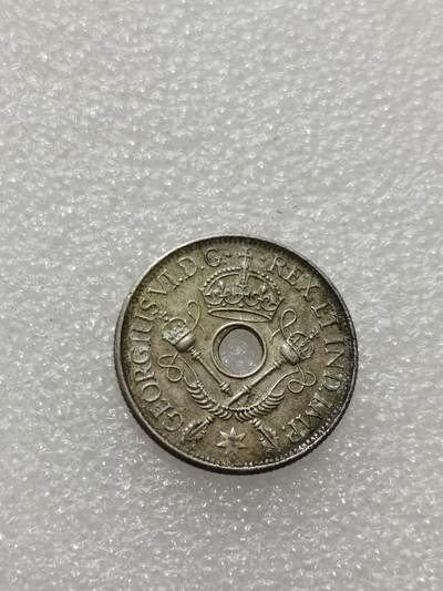 天下钱庄专场欢迎参拍 - 新几内亚中孔银币