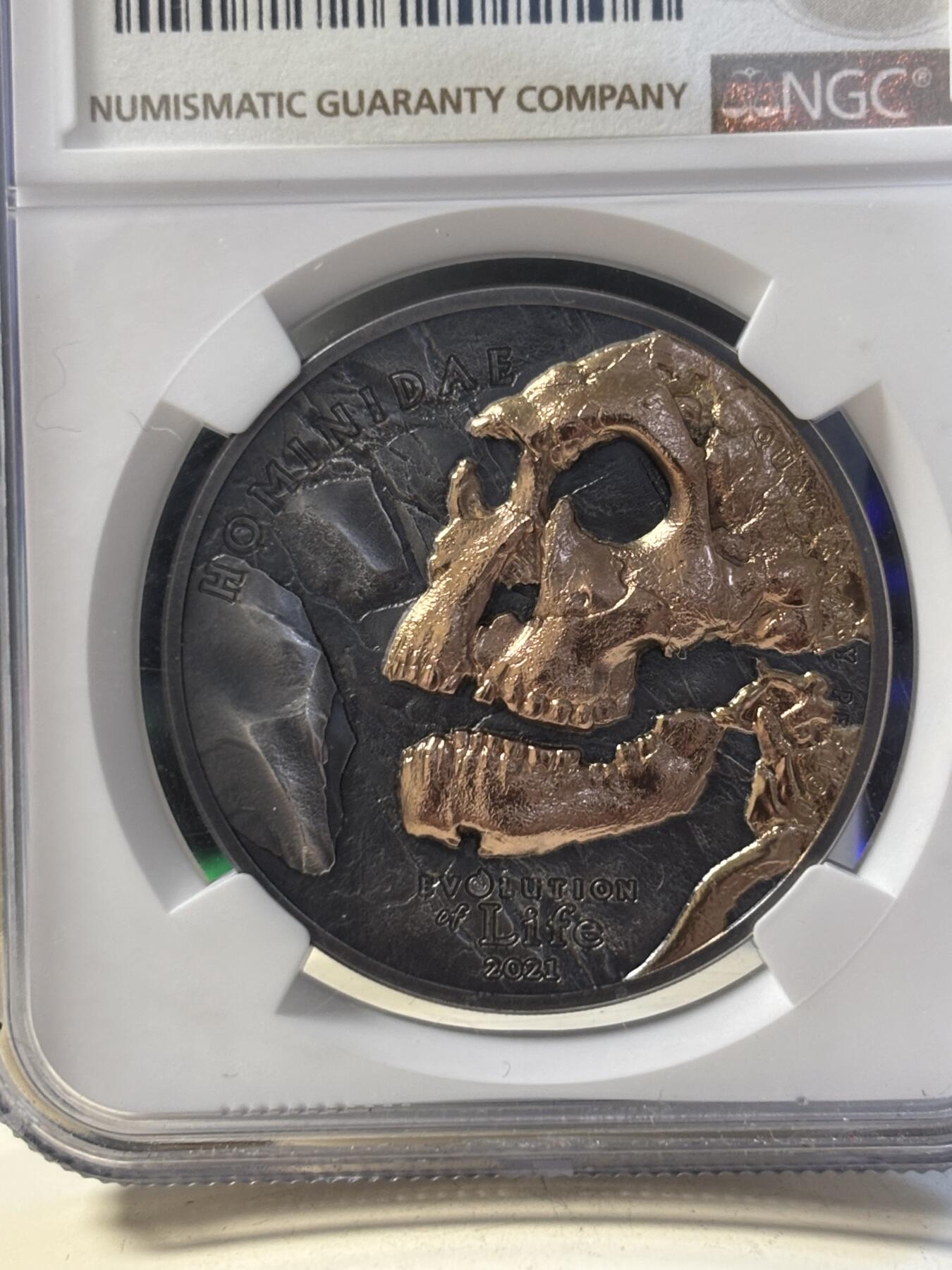 第194期拍卖 蒙古2021年生命进化人类头骨1盎司镀金银币NGC-MS70,999银镀玫瑰金,1盎司,38.61毫米,999枚