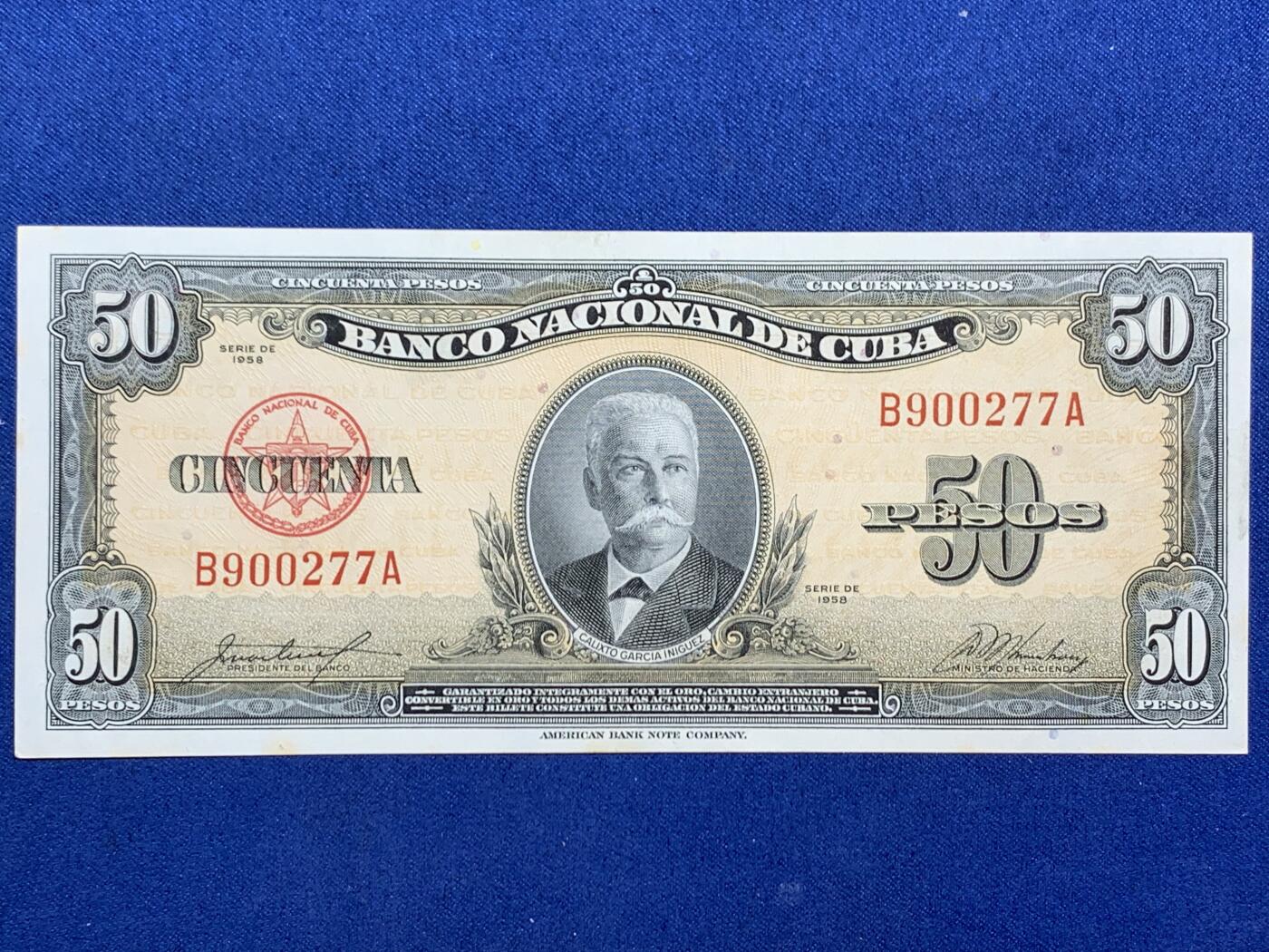 《竞宝斋》第470场 周日，周一，周二 3场连拍 （全场包邮）欢迎送拍 古巴1958年50比索原票，好品状态，无折痕，四角好。美钞公司出品，雕刻精美，色彩诱人，正面人物为古巴开国元勋伊尼古兹将军，炯炯有神，如在目前，背面采用美金黄金券橙黄色油墨，金光璀璨，雍容华贵。细节见图