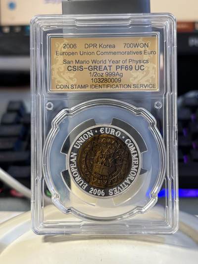 第194期拍卖 - 朝鲜2006年圣马里奥镶嵌虎眼石纪念银币评级69分，999银，15.5克，发行3000枚