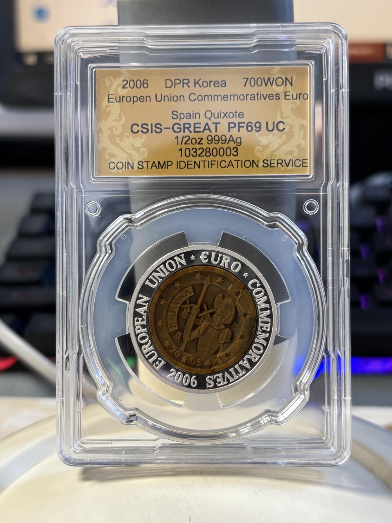 第194期拍卖 朝鲜2006年西班牙镶嵌虎眼石纪念银币信泰评级69分，999银，15.5克，发行3000枚