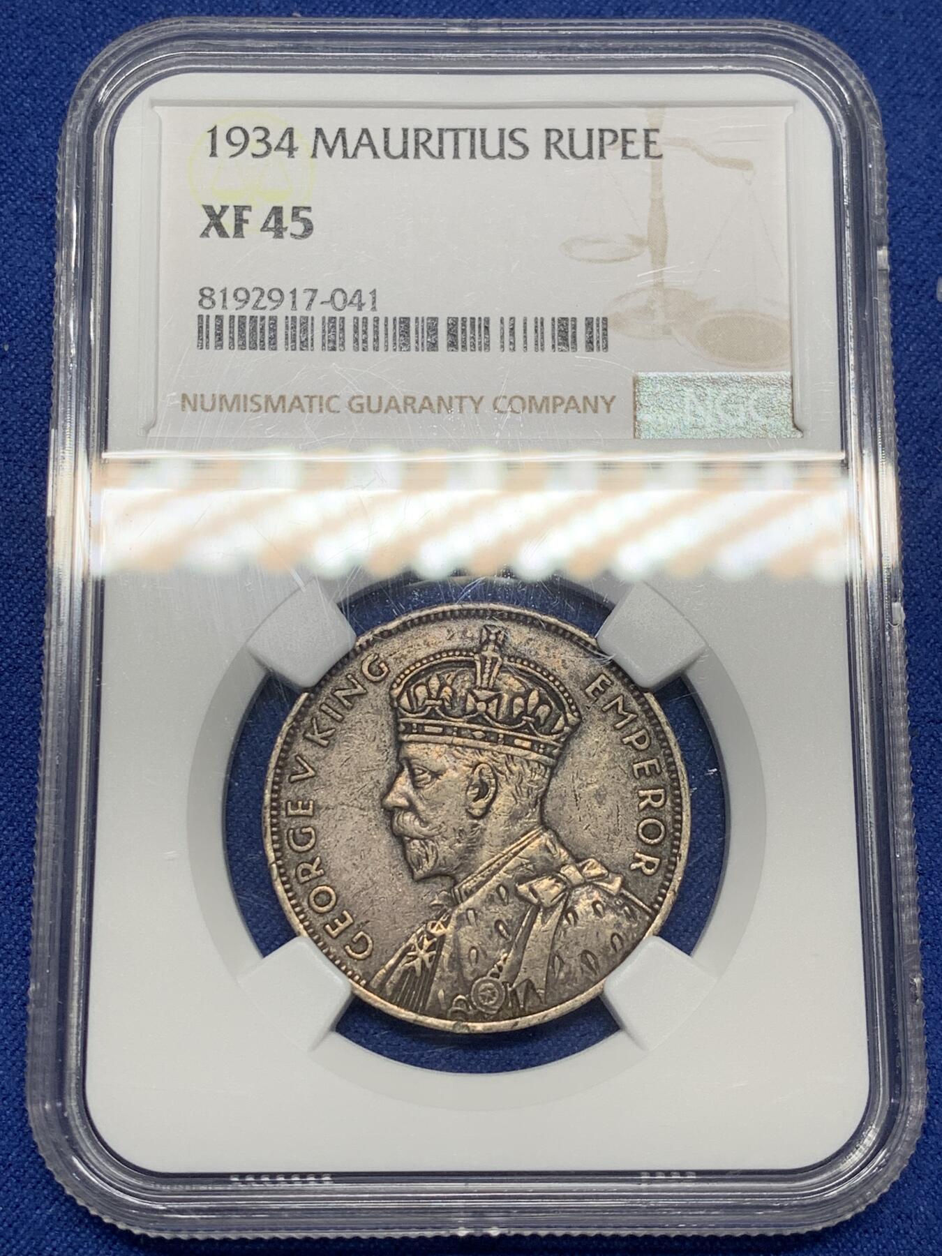 《竞宝斋》第470场 周日，周一，周二 3场连拍 （全场包邮）欢迎送拍 NGC XF45 印度洋岛国毛里求斯1934年1卢比银币，主币，乔治五世像，经典老版，发行量稀少，收藏价值高。币面细节清晰，包浆自然，品相不错。
