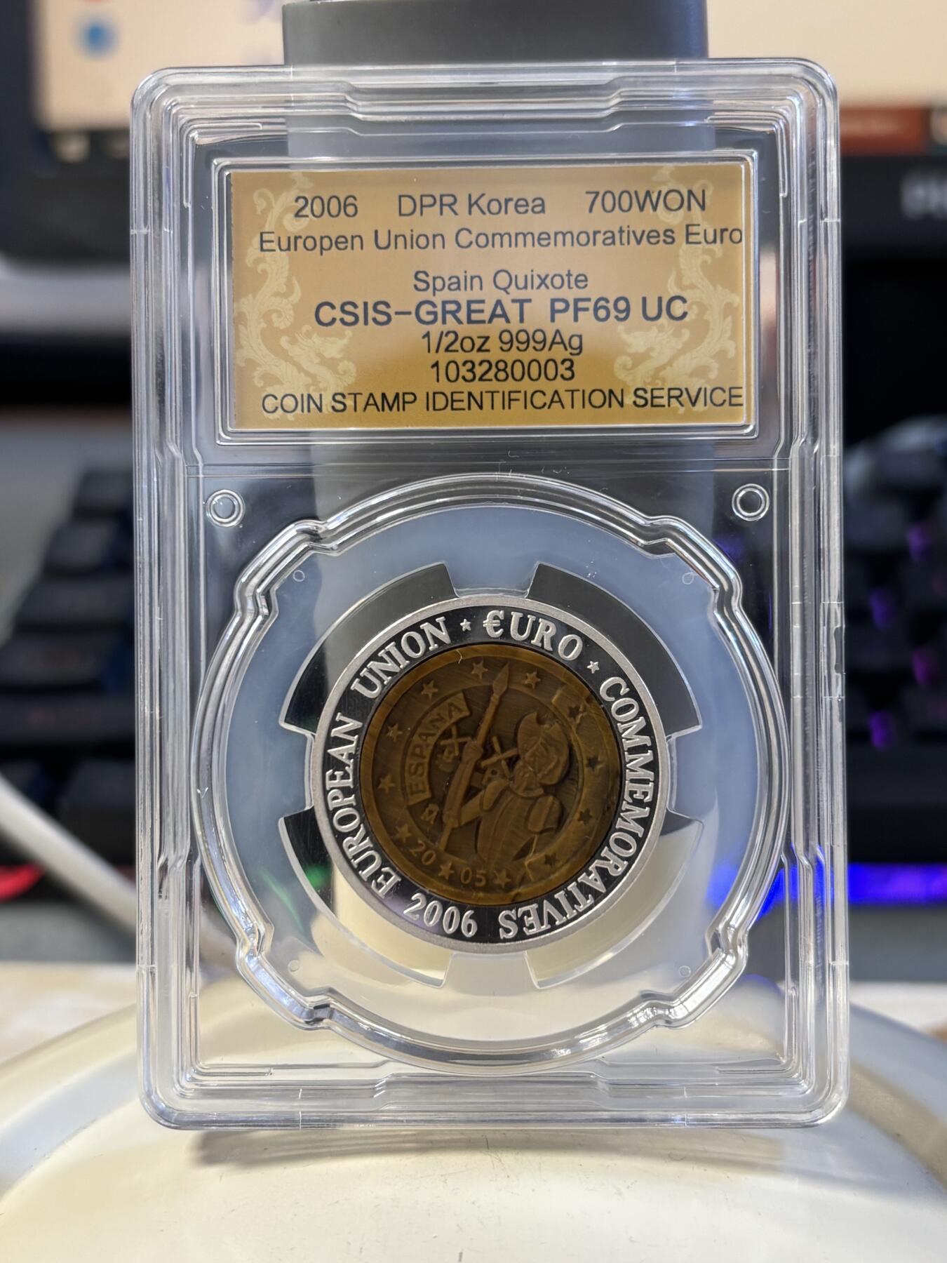 第194期拍卖 朝鲜2006年西班牙镶嵌虎眼石纪念银币信泰评级69分，999银，15.5克，发行3000枚