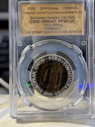 第194期拍卖 - 朝鲜2006年荷尔斯泰因城门镶嵌虎眼石银币信泰69分，999银，15.5克，发行3000枚