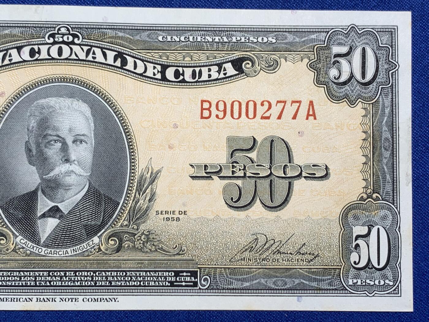 《竞宝斋》第470场 周日，周一，周二 3场连拍 （全场包邮）欢迎送拍 古巴1958年50比索原票，好品状态，无折痕，四角好。美钞公司出品，雕刻精美，色彩诱人，正面人物为古巴开国元勋伊尼古兹将军，炯炯有神，如在目前，背面采用美金黄金券橙黄色油墨，金光璀璨，雍容华贵。细节见图