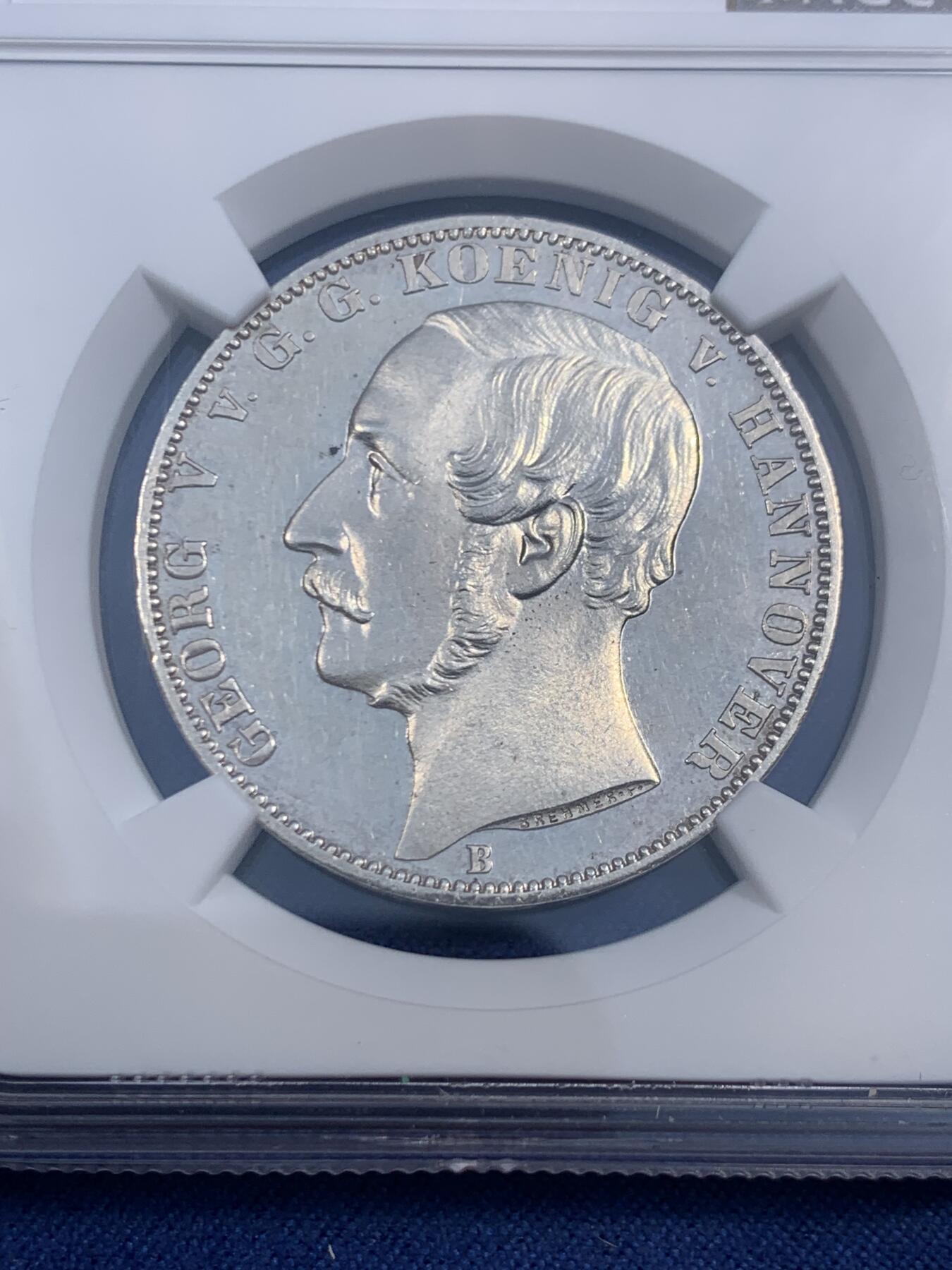 《竞宝斋》第471场 周日，周一，周二 3场连拍 （全场包邮）欢迎送拍 亚军分 NGC MS64 德国 1865汉诺威和东弗里士兰联合50周年纪念泰勒，发行量1000枚，类精制底板 是同系列橡树泰勒发现量的一半 难得一见的汉诺威系列泰勒，状态不用讲，重在少见，收藏潜力巨大