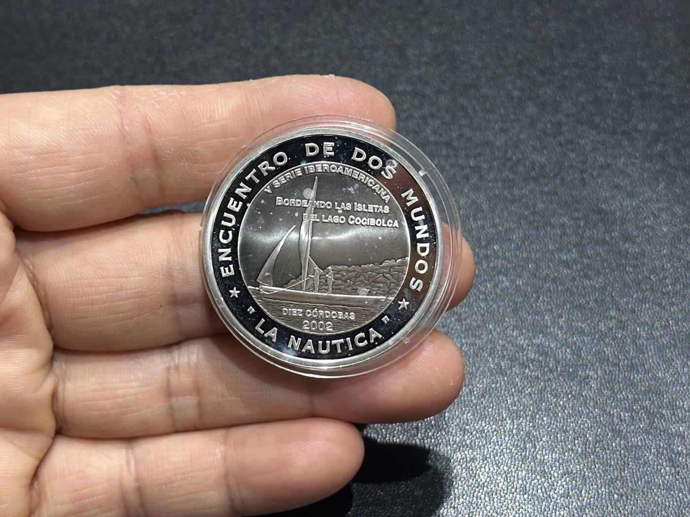 《外钞收藏家》第六百一十八期（精品场）（长期征集拍品、欢迎藏友们联系合作） 尼加拉瓜2002年美洲经济互惠精制纪念银币（27克925银）