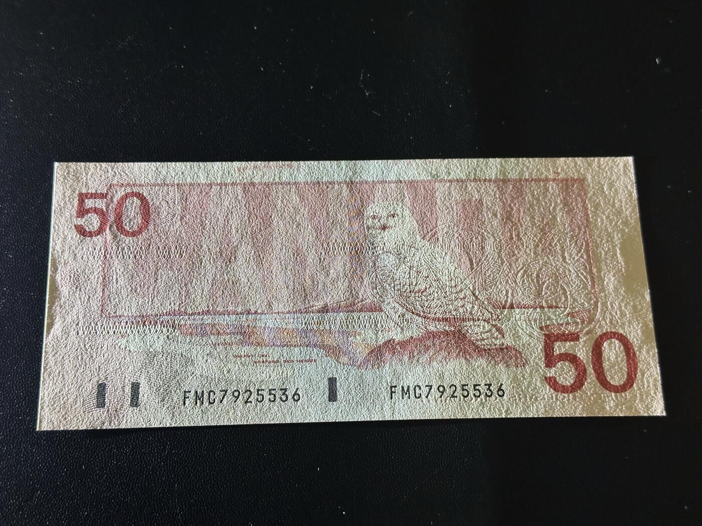 《外钞收藏家》第六百一十八期（精品场）（长期征集拍品、欢迎藏友们联系合作） 加拿大1988年鸟版50元（北极雪鸮，号码全程无4）	UNC