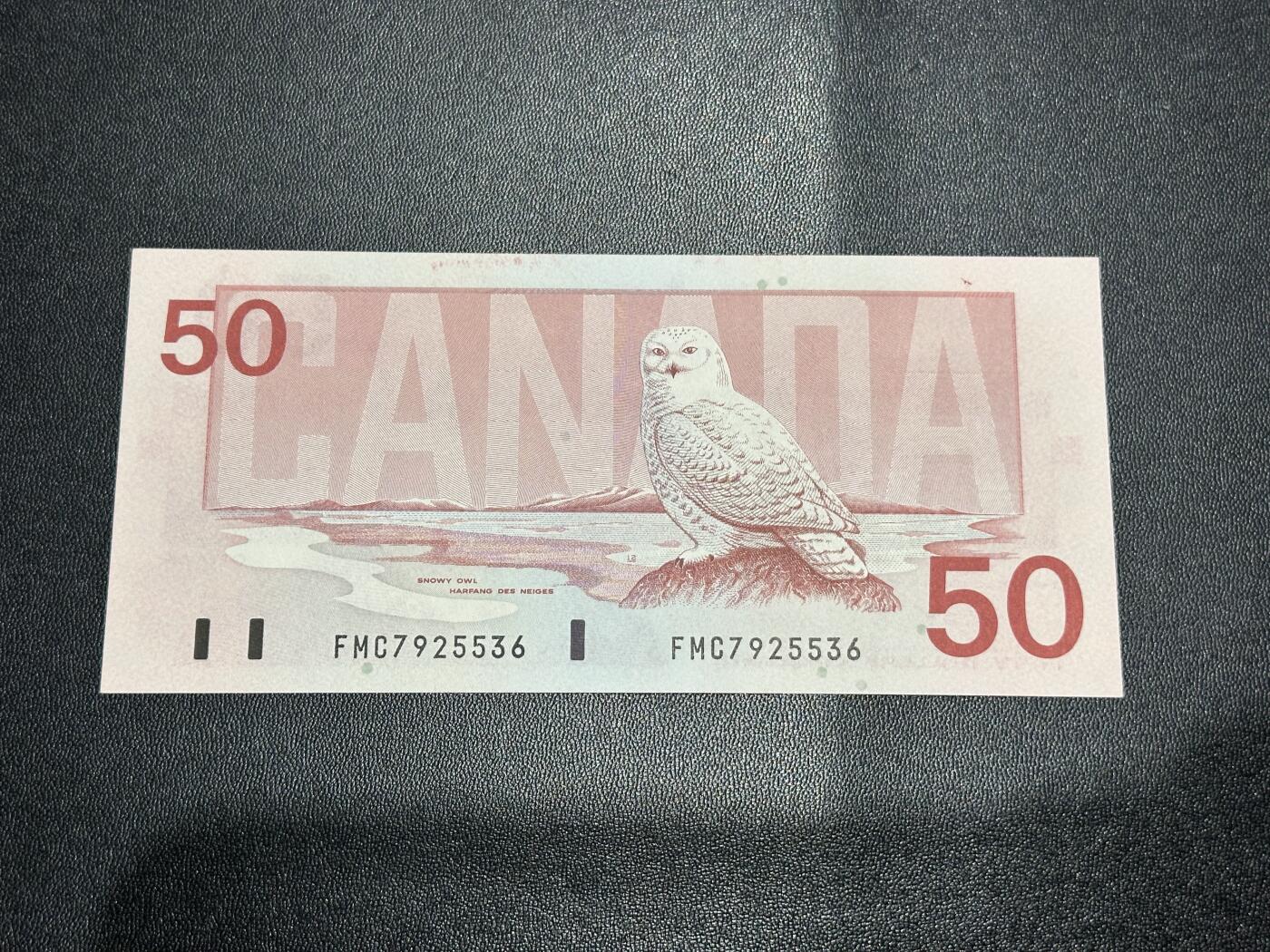 《外钞收藏家》第六百一十八期（精品场）（长期征集拍品、欢迎藏友们联系合作） 加拿大1988年鸟版50元（北极雪鸮，号码全程无4）	UNC