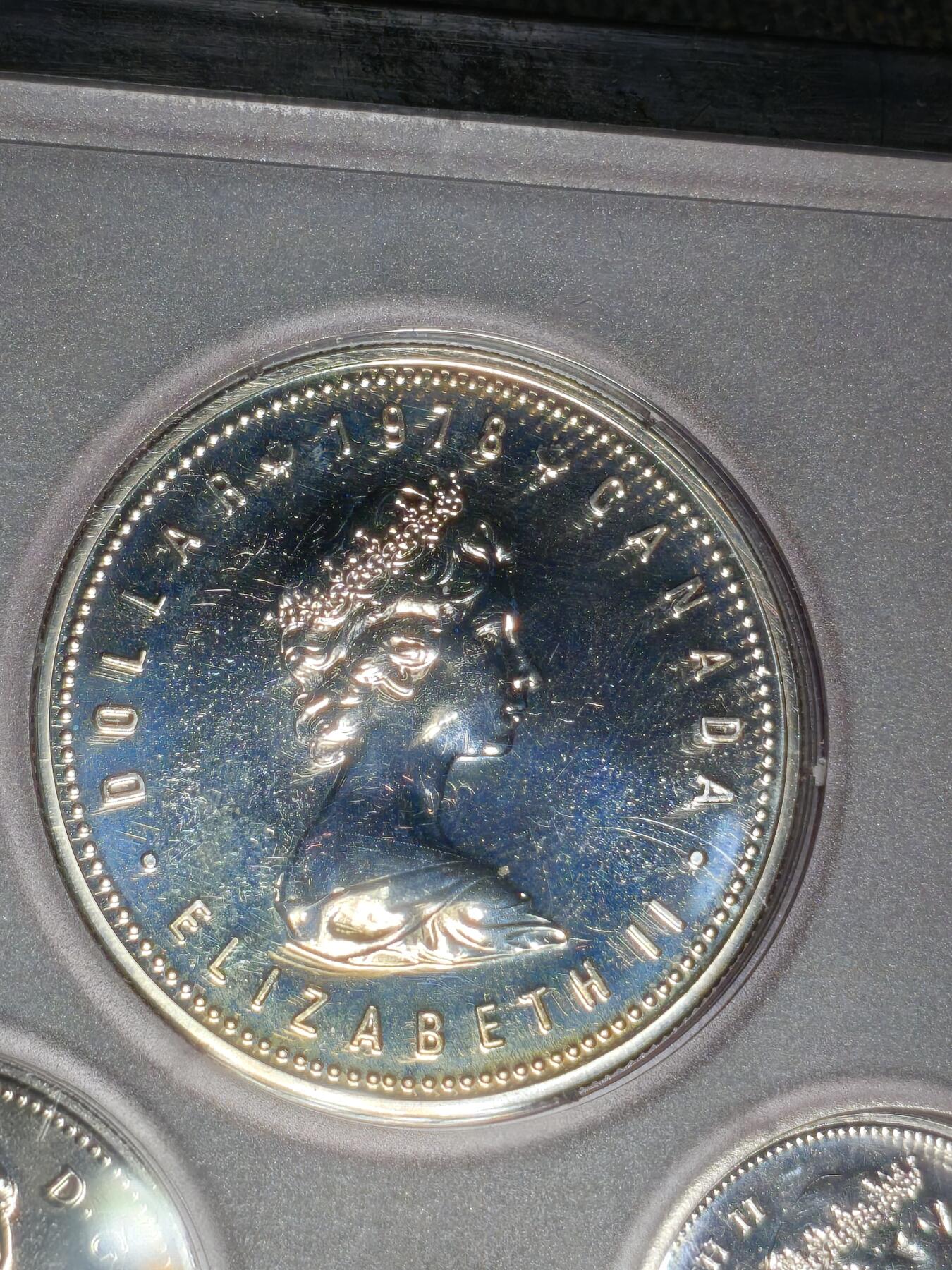 刘世昌艺术品销售中心～虎踞龙蟠*金杨在线联拍群第519期 加拿大1978年《英联邦运动会》原装精铸币一套7枚，其中壹枚1元是银币，重23.33克。原盒证，品相如图。