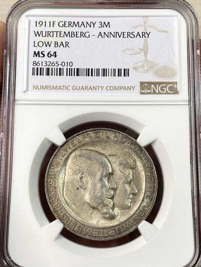 万国钱币拍卖第063期 - NGC MS64 1911年德国符腾堡金婚长翅3马克 浓郁黑玫瑰酱五彩车轮转光