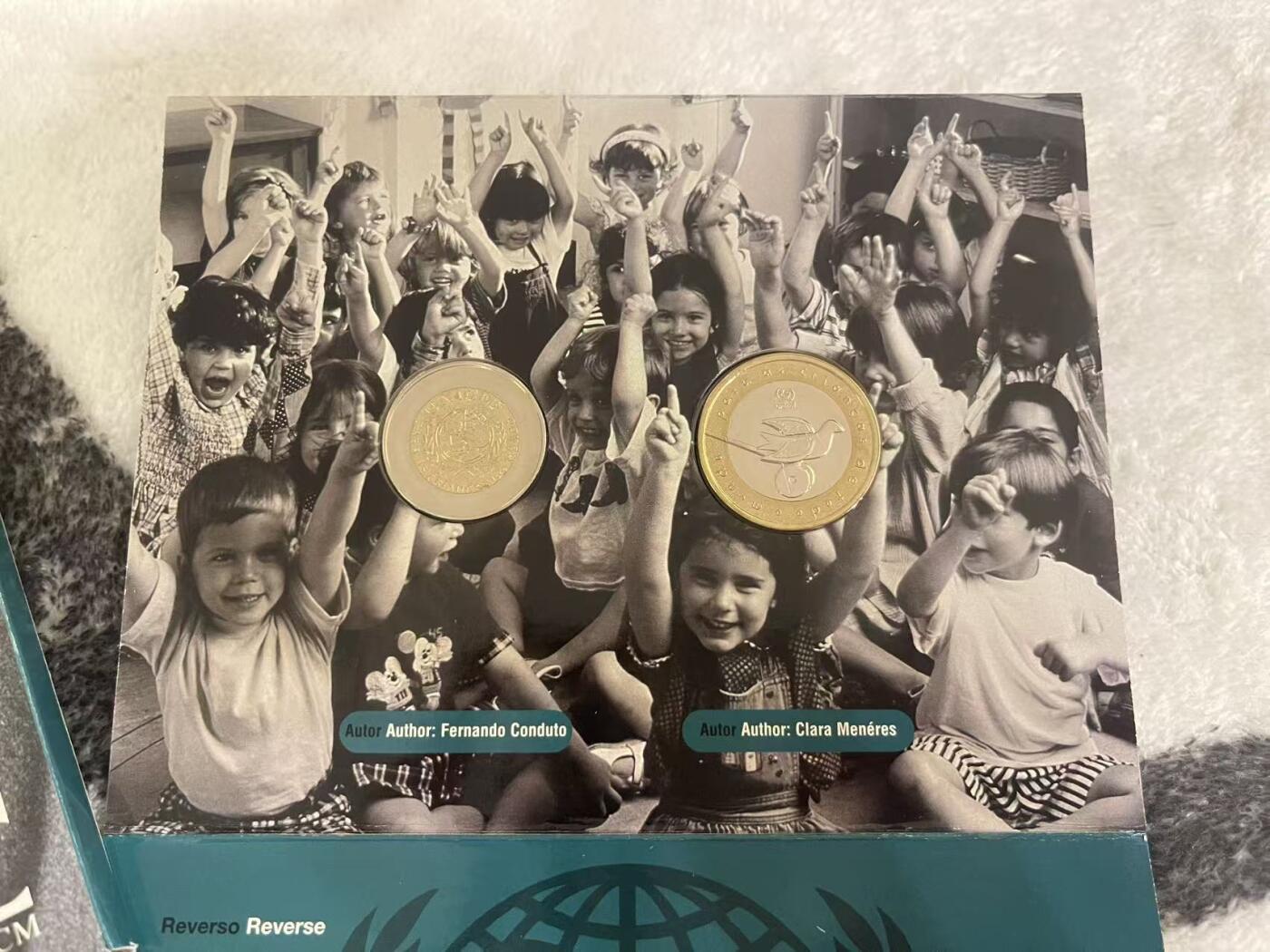 ❤️【币观天下】❤️ 第345期钱币拍卖场- 2026.3.20周五晚上6点半场 长期征集拍品  葡萄牙1999年联合国儿童基金会成立纪念官方套册 含两枚双色高值纪念币 品相如图