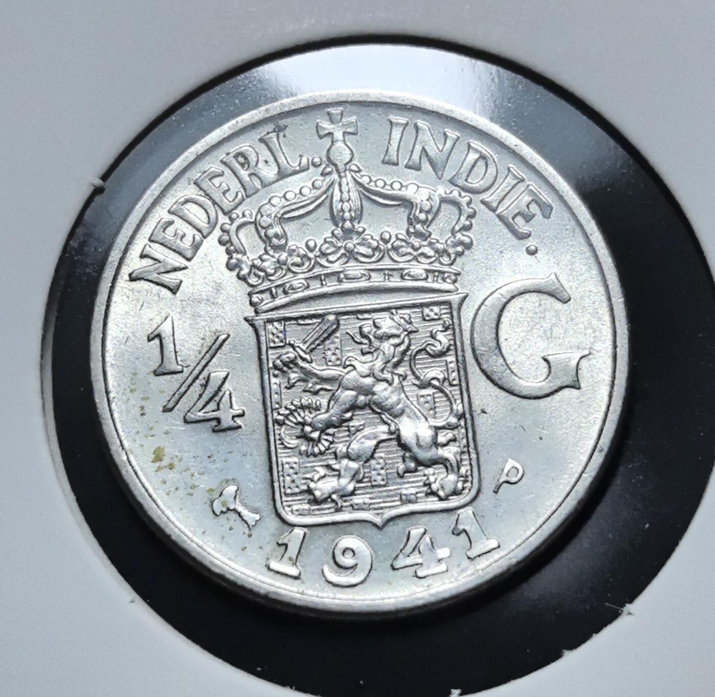 外国优质老铜币银币苏联纪念章，每周六晚九点倒数截拍，满百包邮可寄存，持续收拍 极美品荷属东印度1941 年1/4 盾银币。币面为荷兰王室纹章与 “NEDERL. INDIE” 字样，见证二战期间荷属东印度的殖民货币历史，是荷属殖民地钱币体系的典型代表。