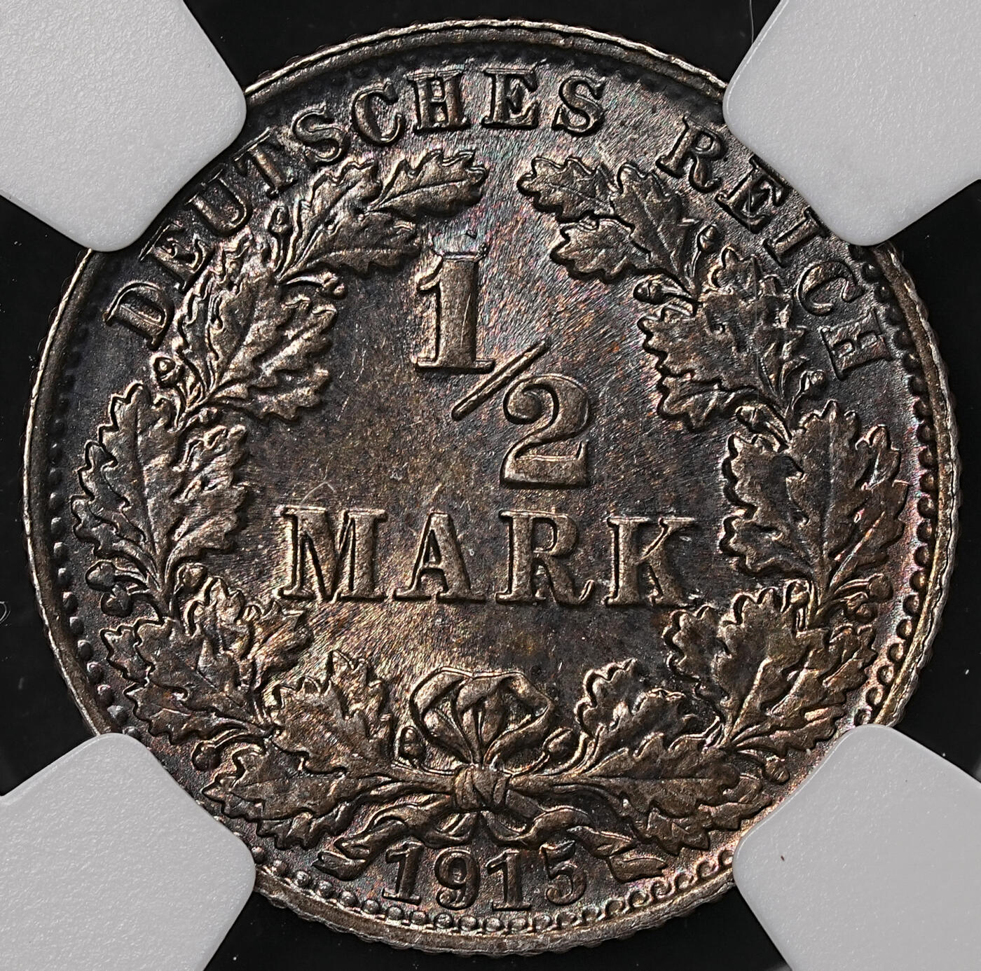 修遠堂世界钱币第108期 NGC MS65 1915年德国1/2马克银币，E厂铭，黑彩